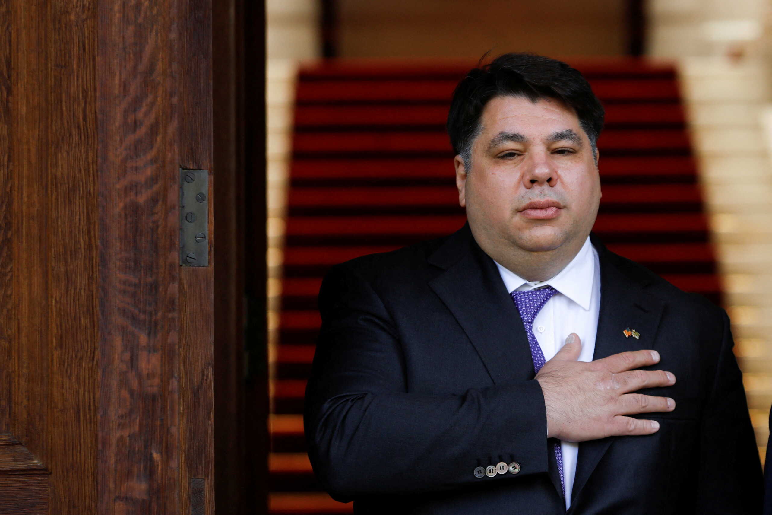 Newly appointed U.S. Ambassador to Greece George Tsounis listens to the U.S. national anthem after a credentials presentation ceremony at the Presidential Palace in Athens, Greece, May 10, 2022. REUTERS