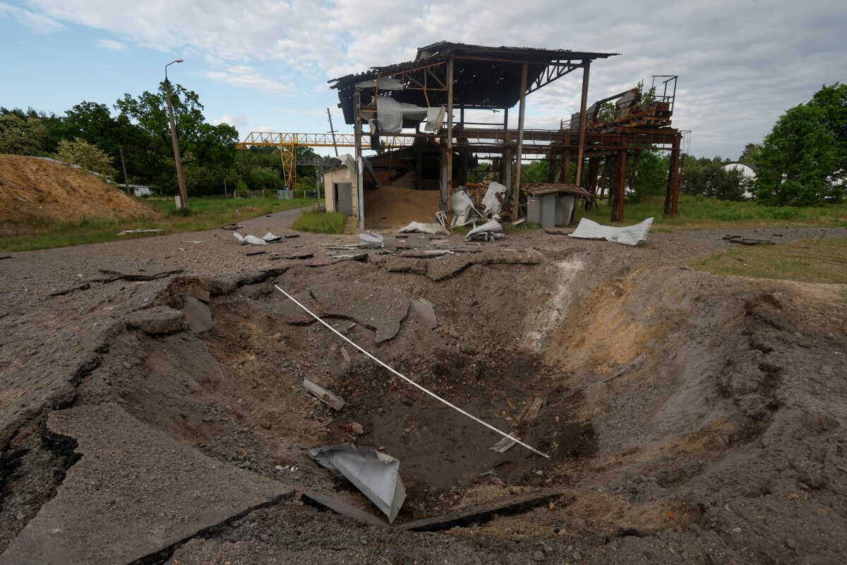 A crater left by a cruise missile hit is seen at a compound of the Darnytsia Car Repair Plant, as Russia's attacks Ukraine in continues, in Kyiv, Ukraine June 5, 2022.  REUTERS