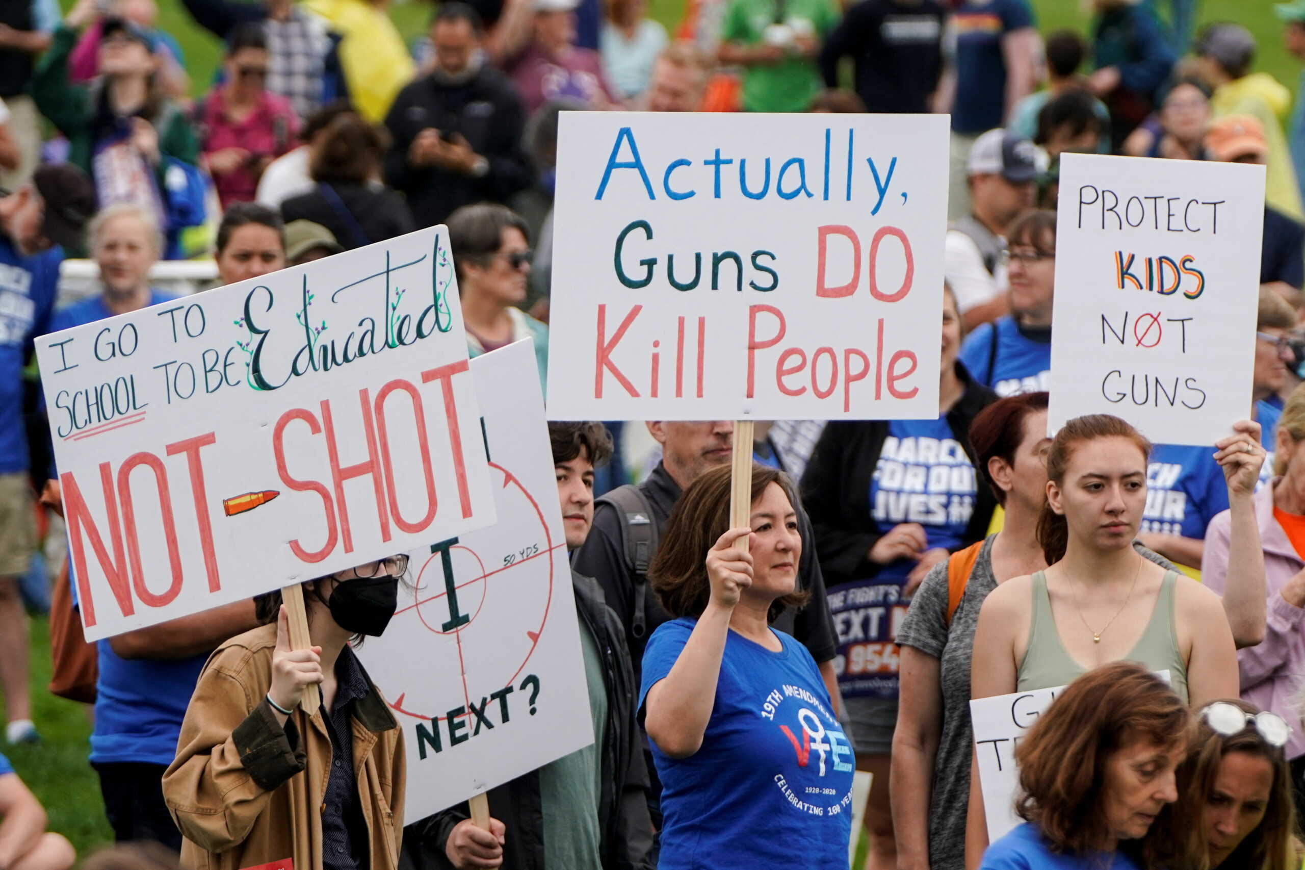 Demonstrators hold placards as they take part in the 'March for Our Lives', one of a series of nationwide protests against gun violence, in Washington, D.C., U.S., June 11, 2022.  REUTERS