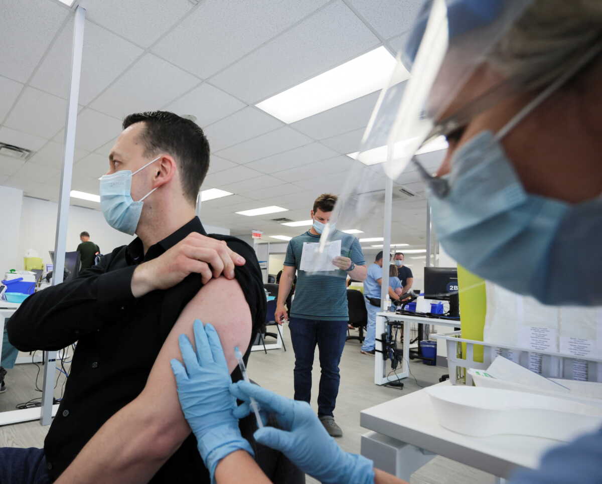 A man is vaccinated at a monkeypox vaccination clinic run by CIUSSS public health authorities in Montreal, Quebec, Canada, June 6, 2022.  REUTERS