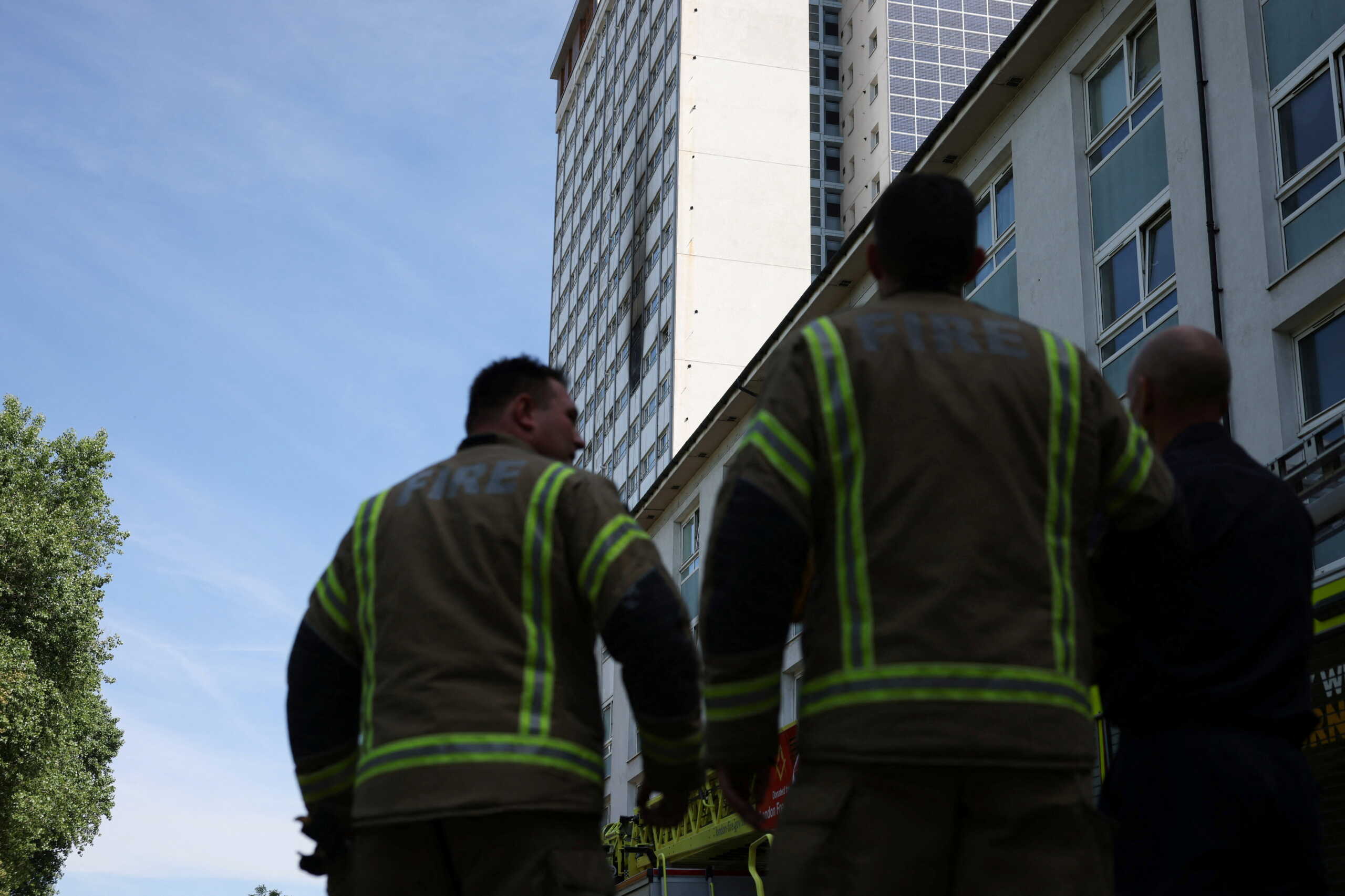 Firefighters work at the site of an apartment fire at Queensdale Crescent tower block, near the Grenfell Tower, in Shepherd's Bush, London, Britain June 21, 2022. REUTERS
