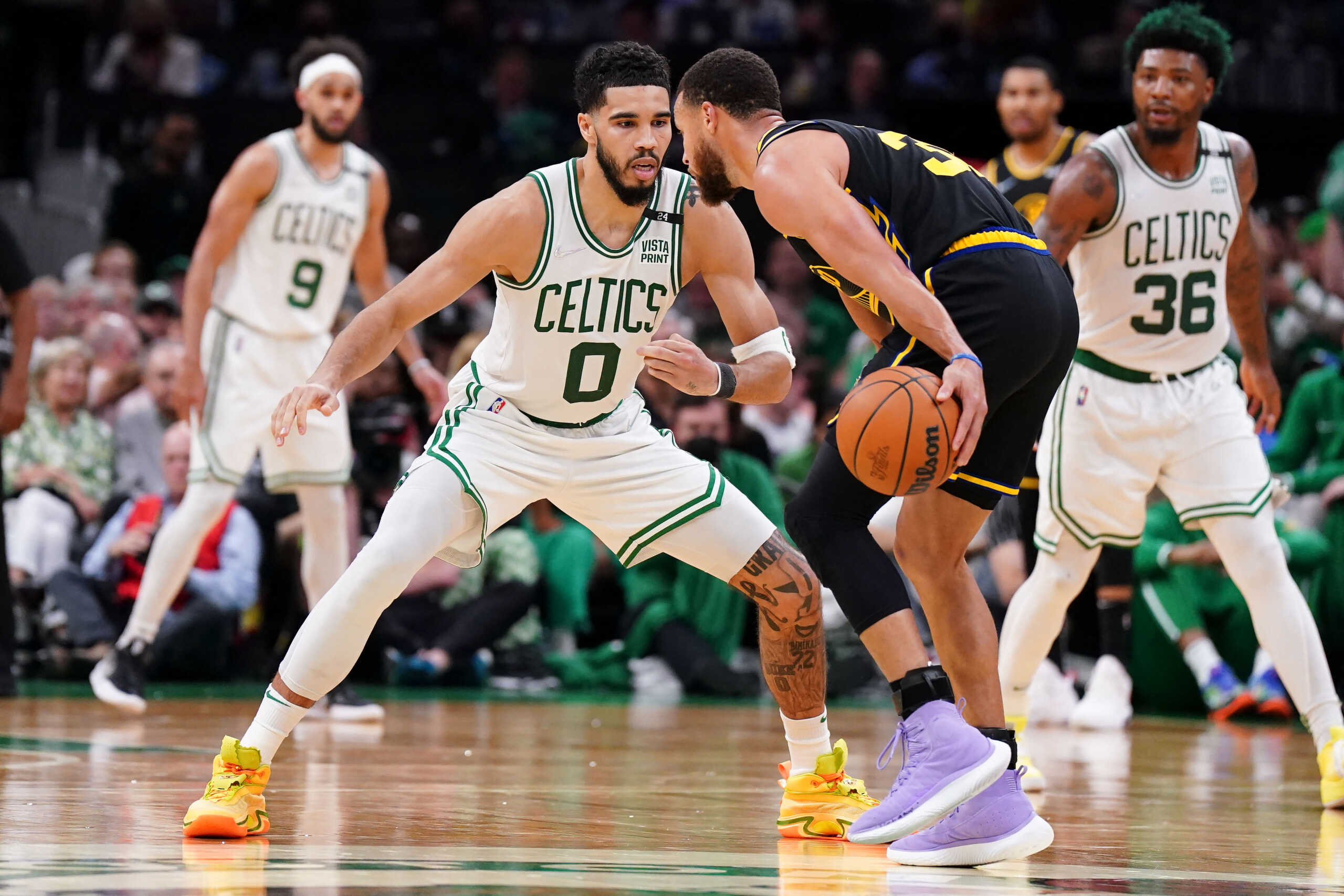 Jun 10, 2022; Boston, Massachusetts, USA; Golden State Warriors guard Stephen Curry (30) dribbles the ball against Boston Celtics forward Jayson Tatum (0) during the third quarter of game four in the 2022 NBA Finals at the TD Garden. Mandatory Credit: David Butler II-USA TODAY Sports