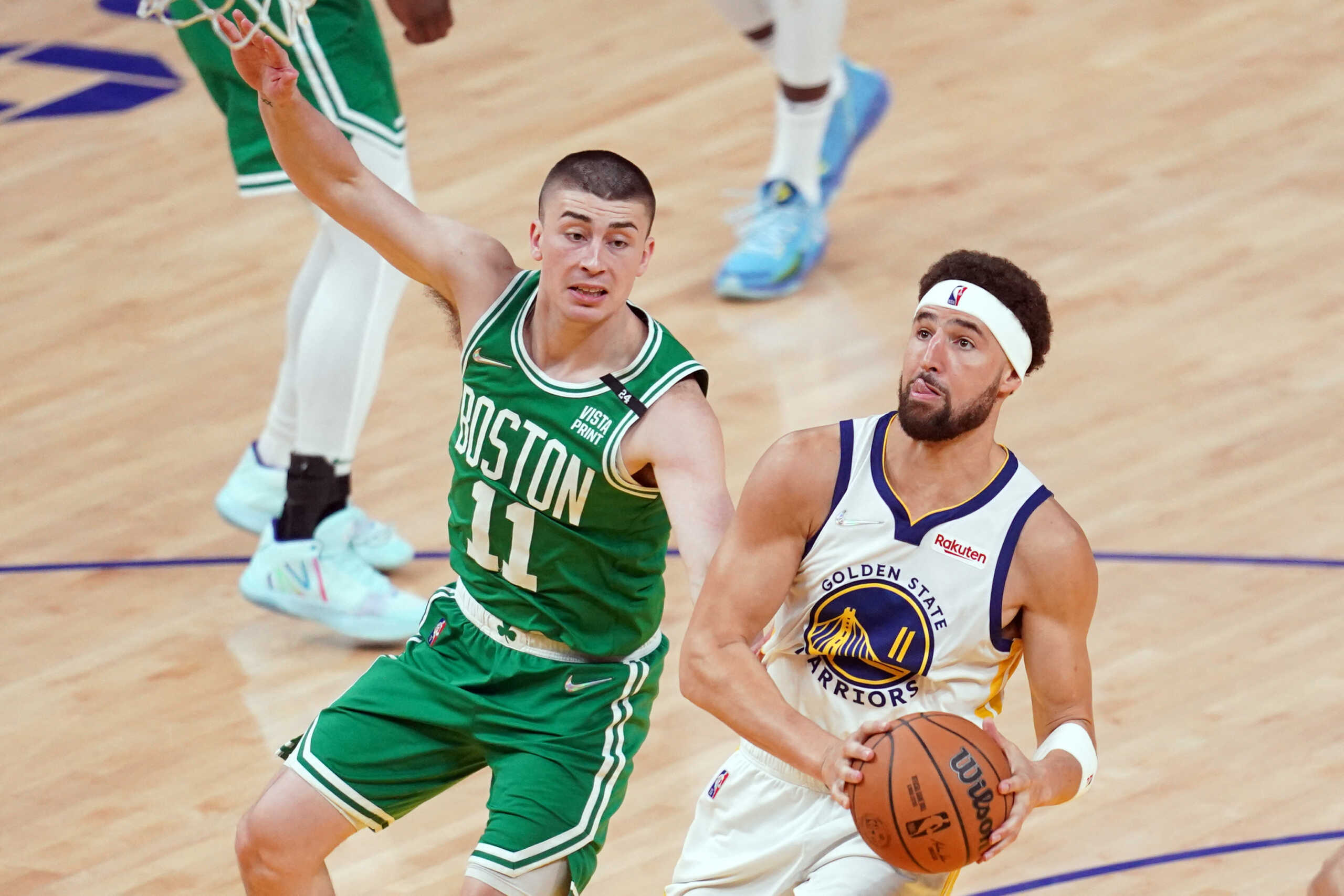 Jun 5, 2022; San Francisco, California, USA; Golden State Warriors guard Klay Thompson (11) shoots against Boston Celtics guard Payton Pritchard (11) in the fourth quarter during game two of the 2022 NBA Finals at Chase Center. Mandatory Credit: Cary Edmondson-USA TODAY Sports