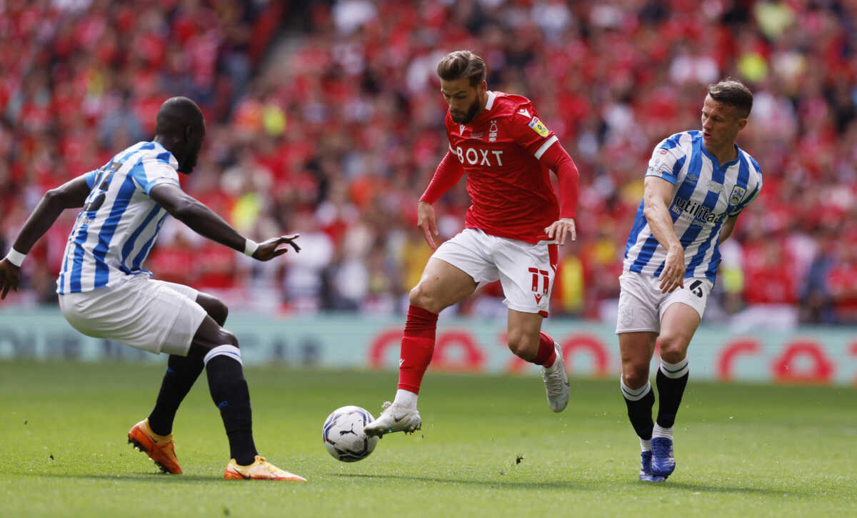 Soccer Football - Championship Play-Off Final - Huddersfield Town v Nottingham Forest - Wembley Stadium, London, Britain - May 29, 2022 Nottingham Forest's Philip Zinckernagel in action with Huddersfield Town's Naby Sarr and Jonathan Hogg Action Images via Reuters