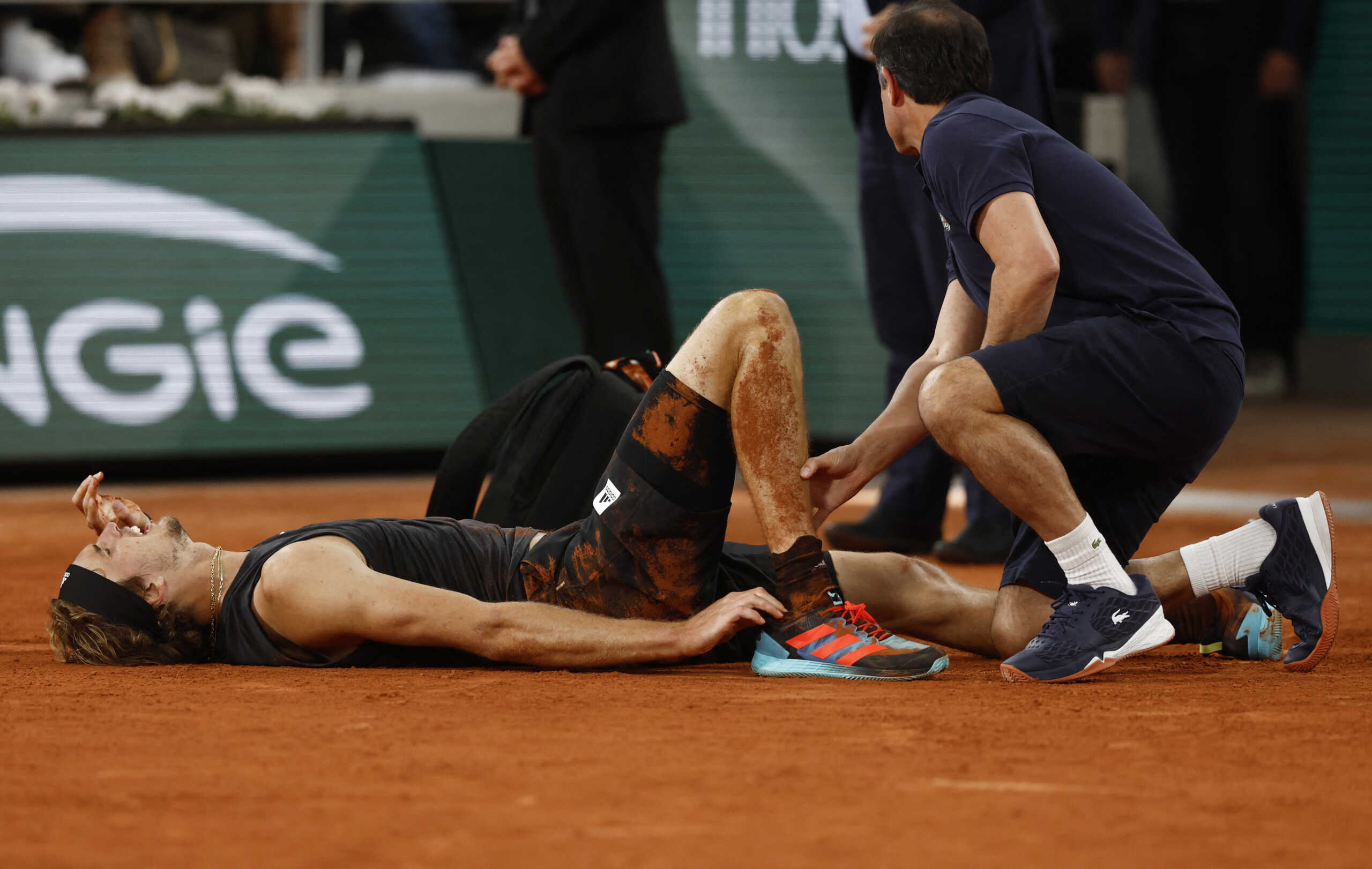 Tennis - French Open - Roland Garros, Paris, France - June 3, 2022 Germany's Alexander Zverev receives medical attention after sustaining an injury REUTERS