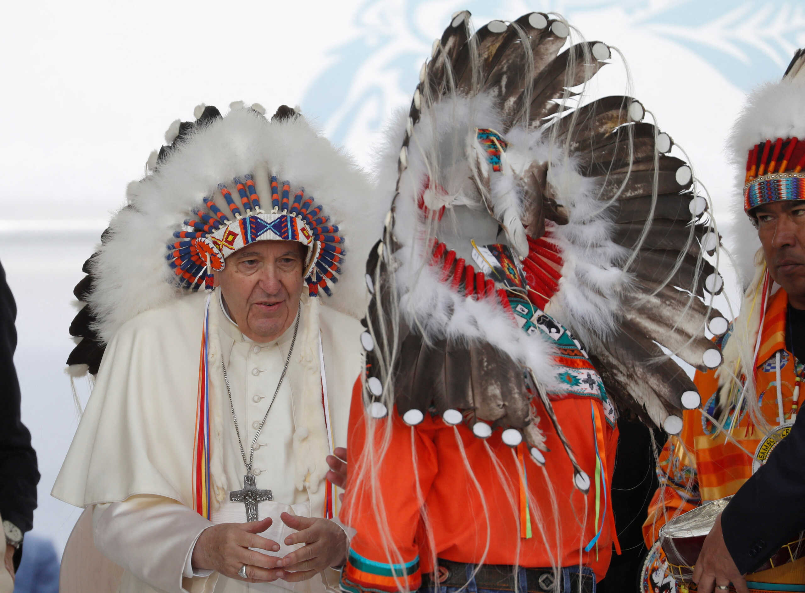 Pope Francis receives a headdress from indigenous people during his visit to Maskwacis, Alberta, Canada July 25, 2022.  REUTERS