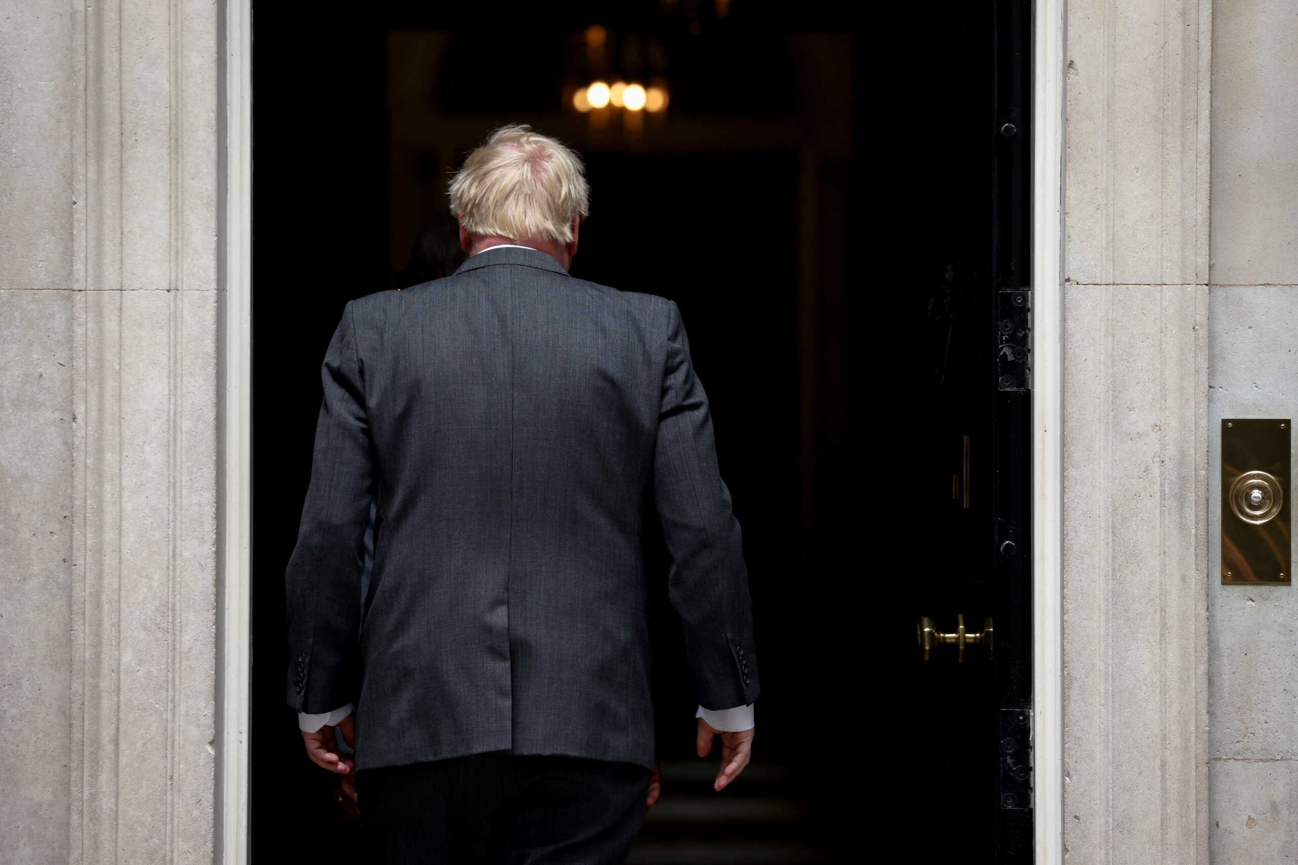 British Prime Minister Boris Johnson enters Downing Street in London, Britain, June 13, 2022. REUTERS