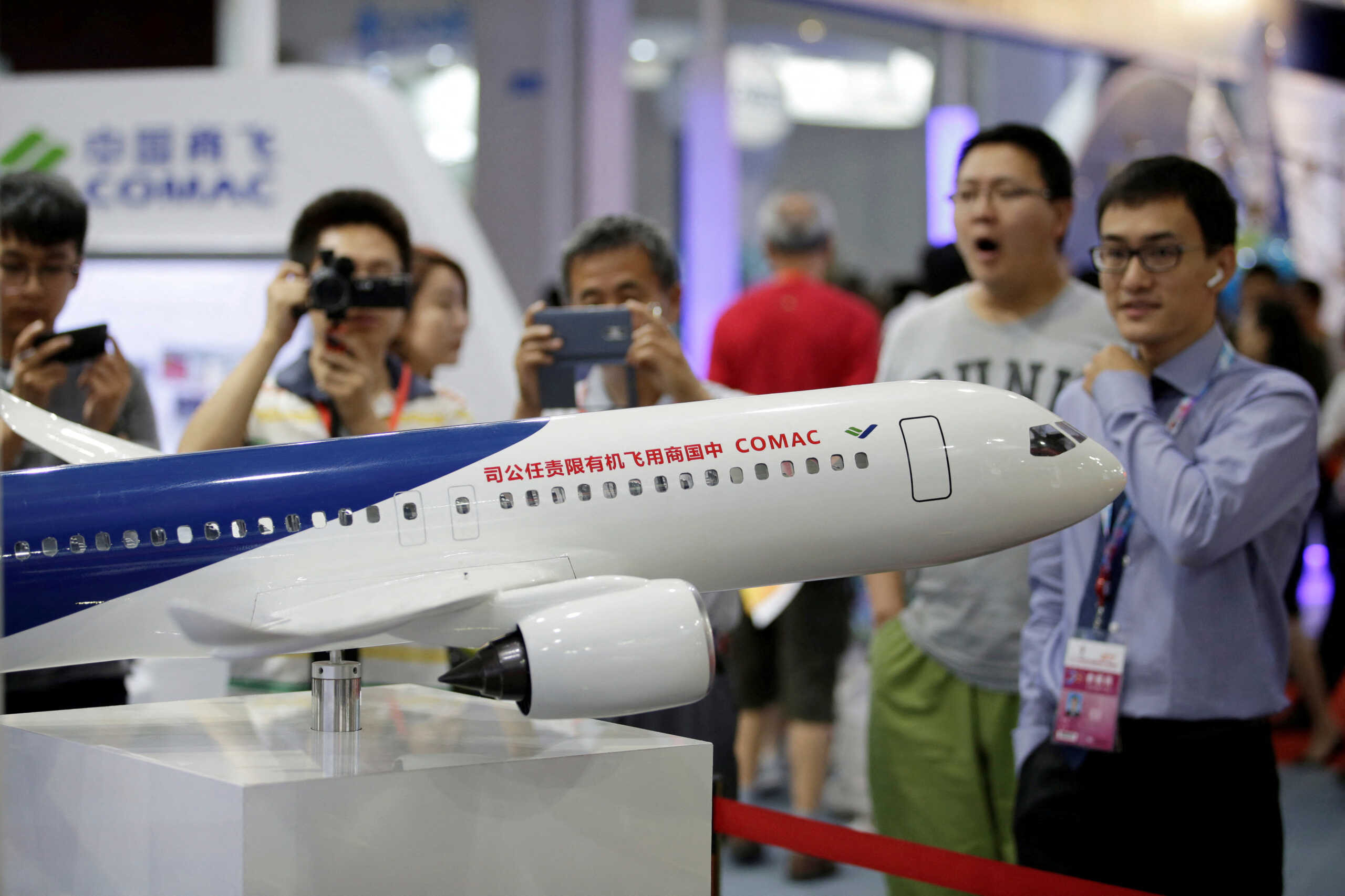FILE PHOTO: A model of a C919 airliner by Commercial Aircraft Corp of China (COMAC) is displayed at China Beijing International High-tech Expo in Beijing, China June 8, 2017. REUTERS