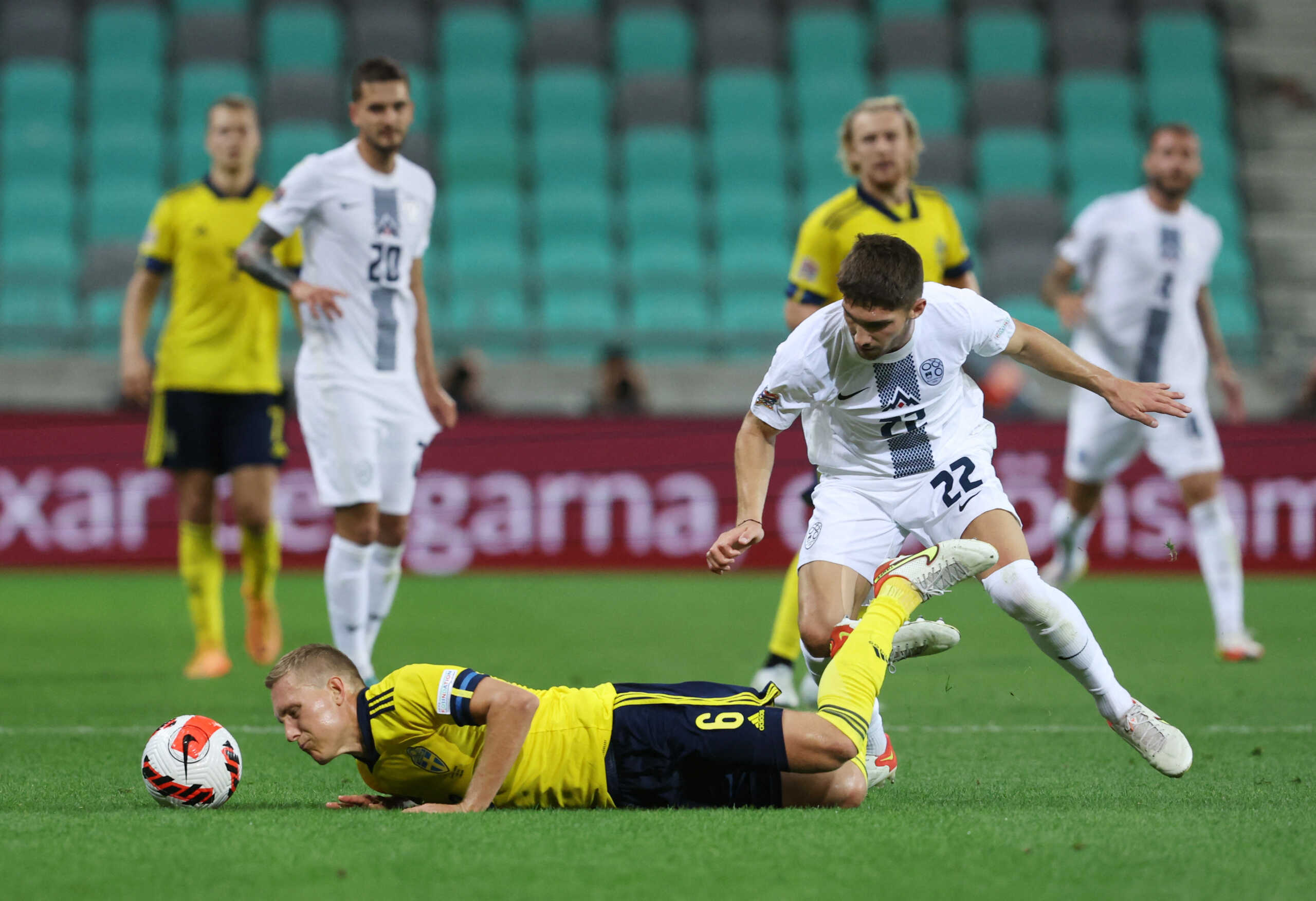 Soccer Football - UEFA Nations League - Group H - Slovenia v Sweden - Stozice Stadium, Ljubljana, Slovenia - June 2, 2022 Sweden's Ludwig Augustinsson in action with Slovenia's Adam Gnezda Cerin REUTERS