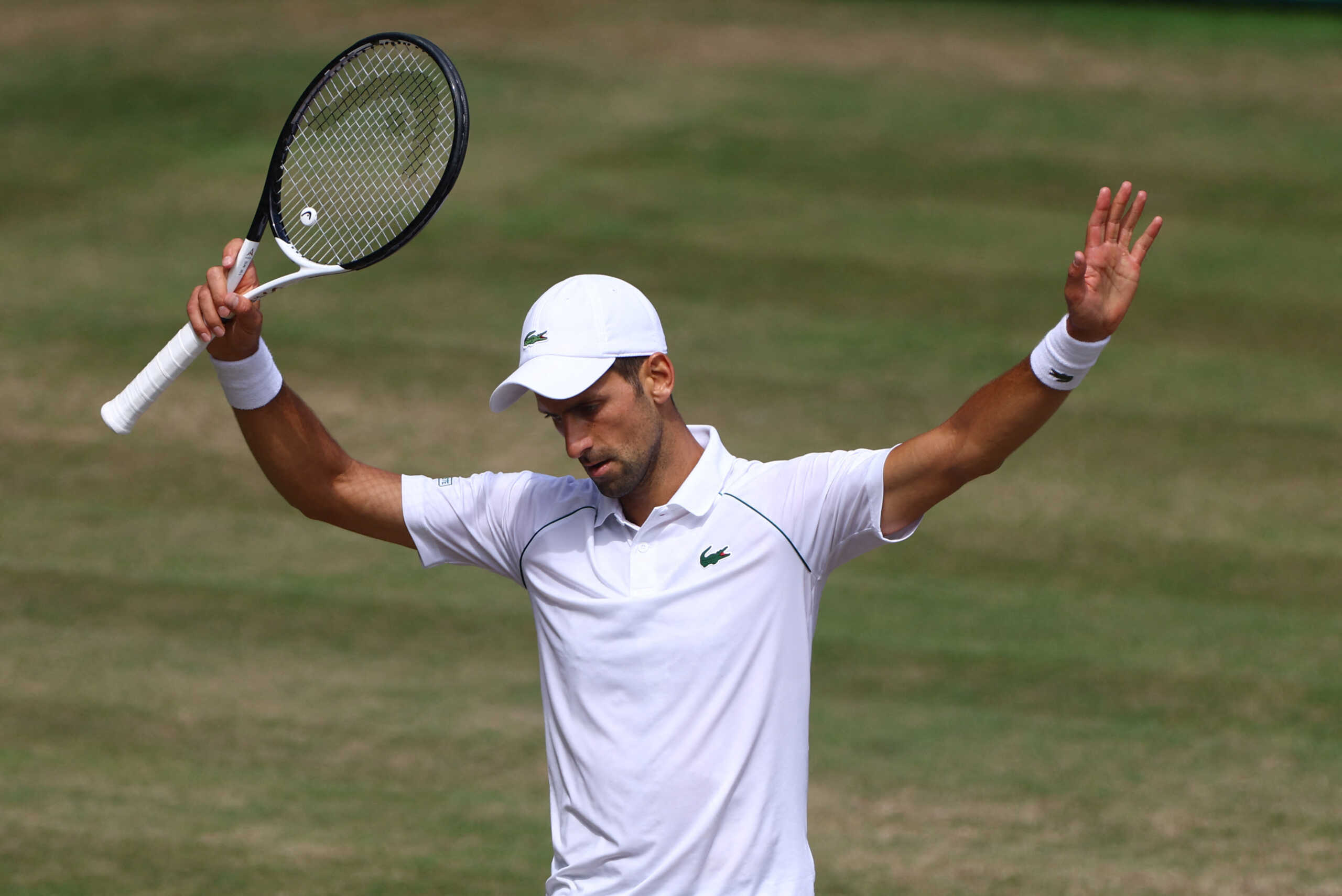 Tennis - Wimbledon - All England Lawn Tennis and Croquet Club, London, Britain - July 10, 2022 Serbia's Novak Djokovic reacts during the men's singles final against Australia's Nick Kyrgios REUTERS