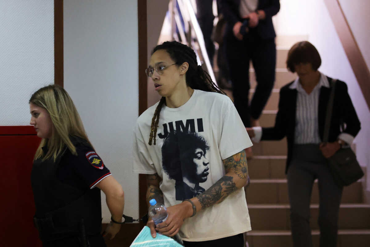 U.S. basketball player Brittney Griner, who was detained in March at Moscow's Sheremetyevo airport and later charged with illegal possession of cannabis, is escorted before a court hearing in Khimki outside Moscow, Russia July 1, 2022. REUTERS