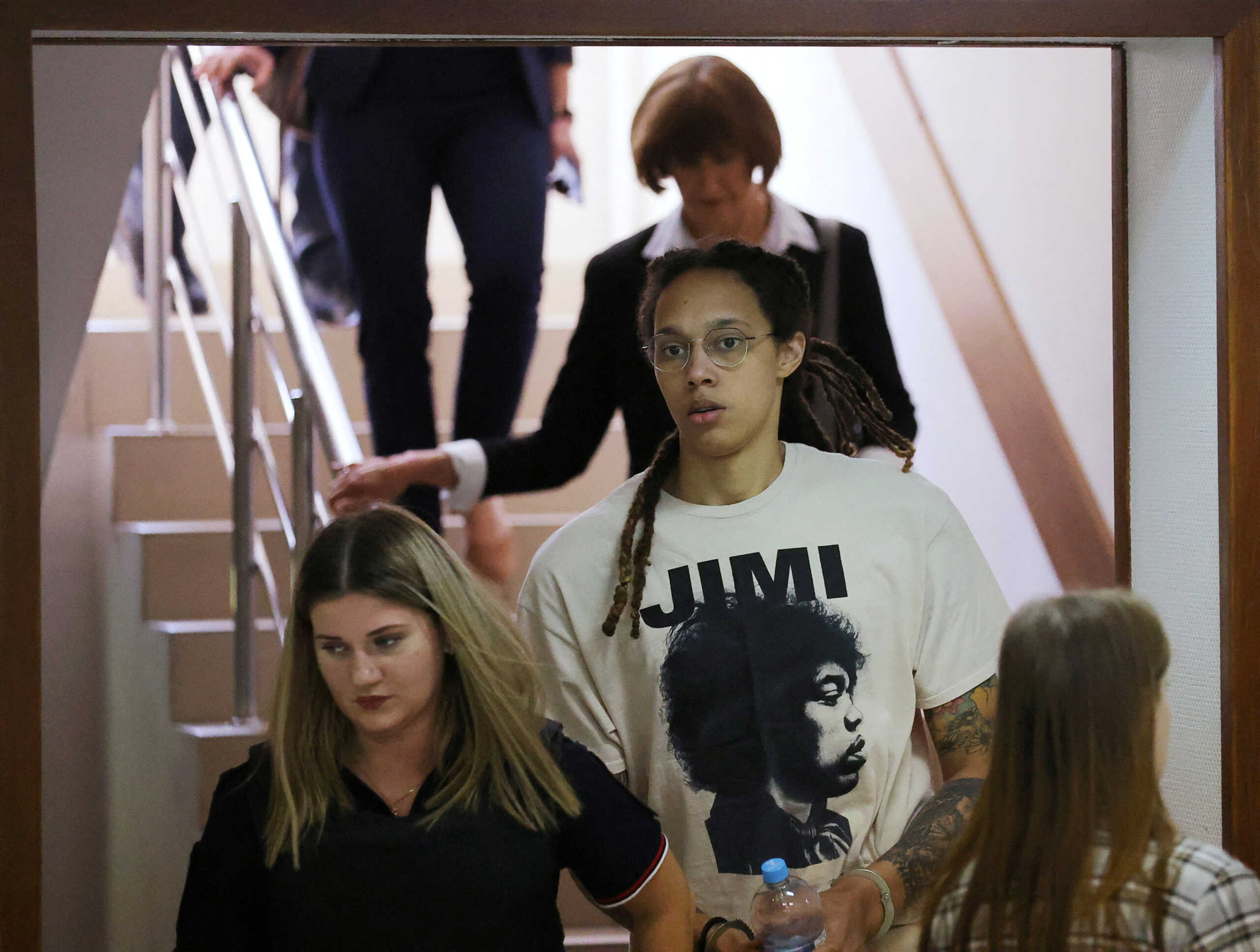 U.S. basketball player Brittney Griner, who was detained in March at Moscow's Sheremetyevo airport and later charged with illegal possession of cannabis, is escorted before a court hearing in Khimki outside Moscow, Russia July 1, 2022. REUTERS