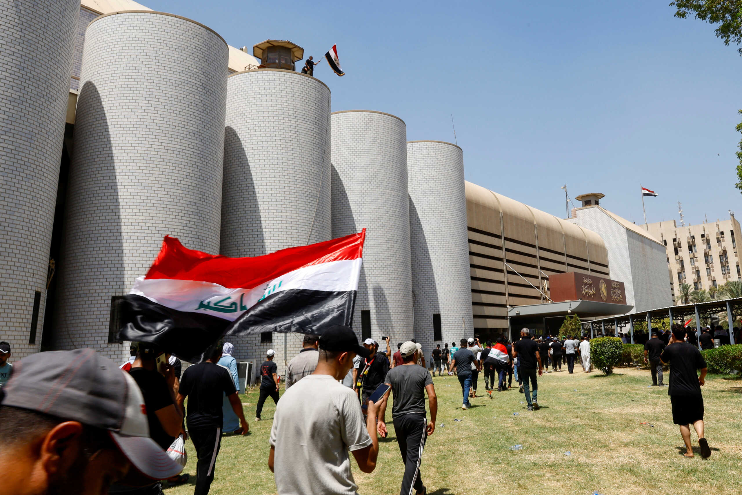 Supporters of Iraqi Shi'ite cleric Moqtada al-Sadr protest against corruption, at the parliament in Baghdad, Iraq July 30, 2022. REUTERS