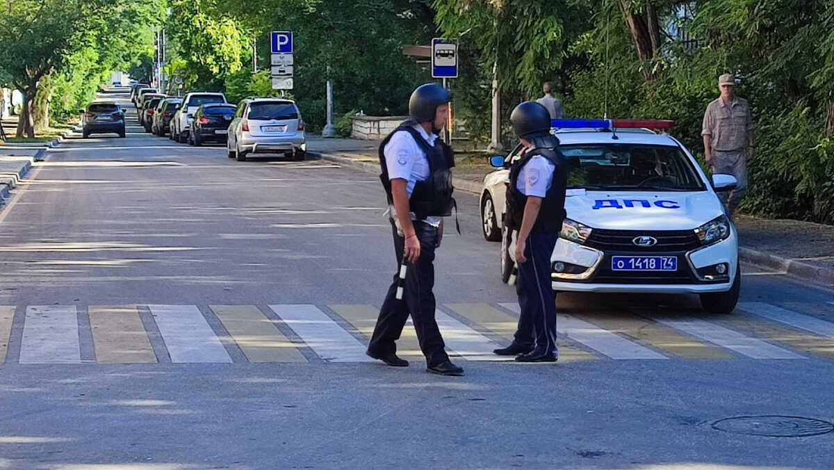 Law enforcement officers block a street following a reported combat drone attack on the Russian Black Sea Fleet's headquarters in Sevastopol, Crimea July 31, 2022. REUTERS