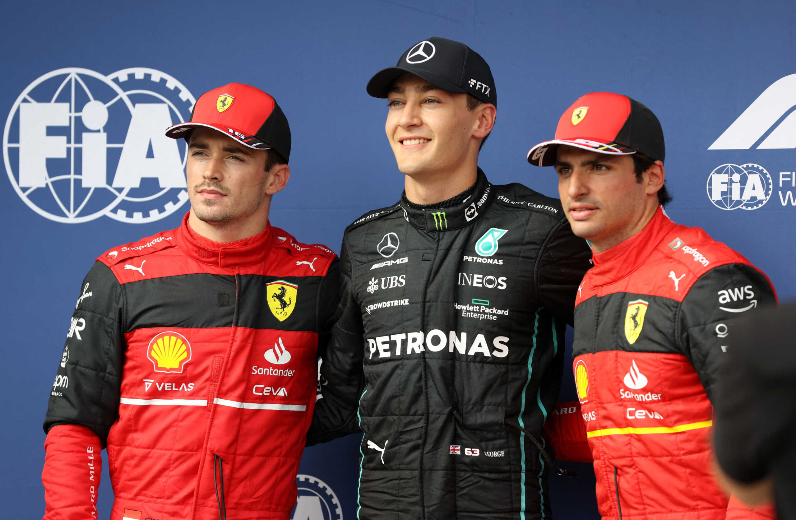 Formula One F1 - Hungarian Grand Prix - Hungaroring, Budapest, Hungary - July 30, 2022 Mercedes' George Russell poses for a picture after qualifying in pole position with second placed, Ferrari's Carlos Sainz Jr. and third placed, Ferrari's Charles Leclerc REUTERS