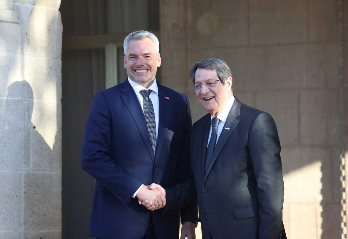 Cypriot President Nicos Anastasiades and Austrian Chancellor Karl Nehammer shake hands during a welcome ceremony at the Presidential Palace in Nicosia, Cyprus July 13, 2022. REUTERS