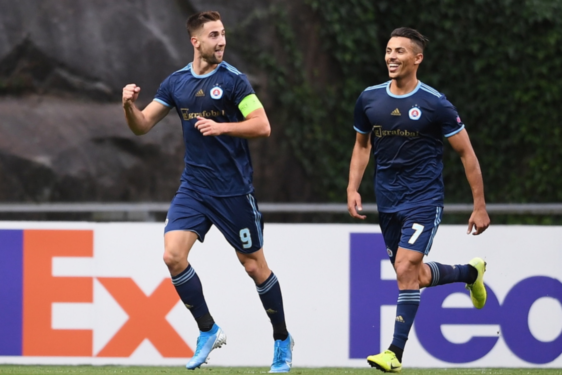 epa07892825 SK Slovan Bratislava's Andraz Sporar (L) celebrates after scoring a goal against SC Braga during their UEFA Europa League soccer match held at Municipal de Braga Stadium, in Braga, Portugal, 03 October 2019.  EPA