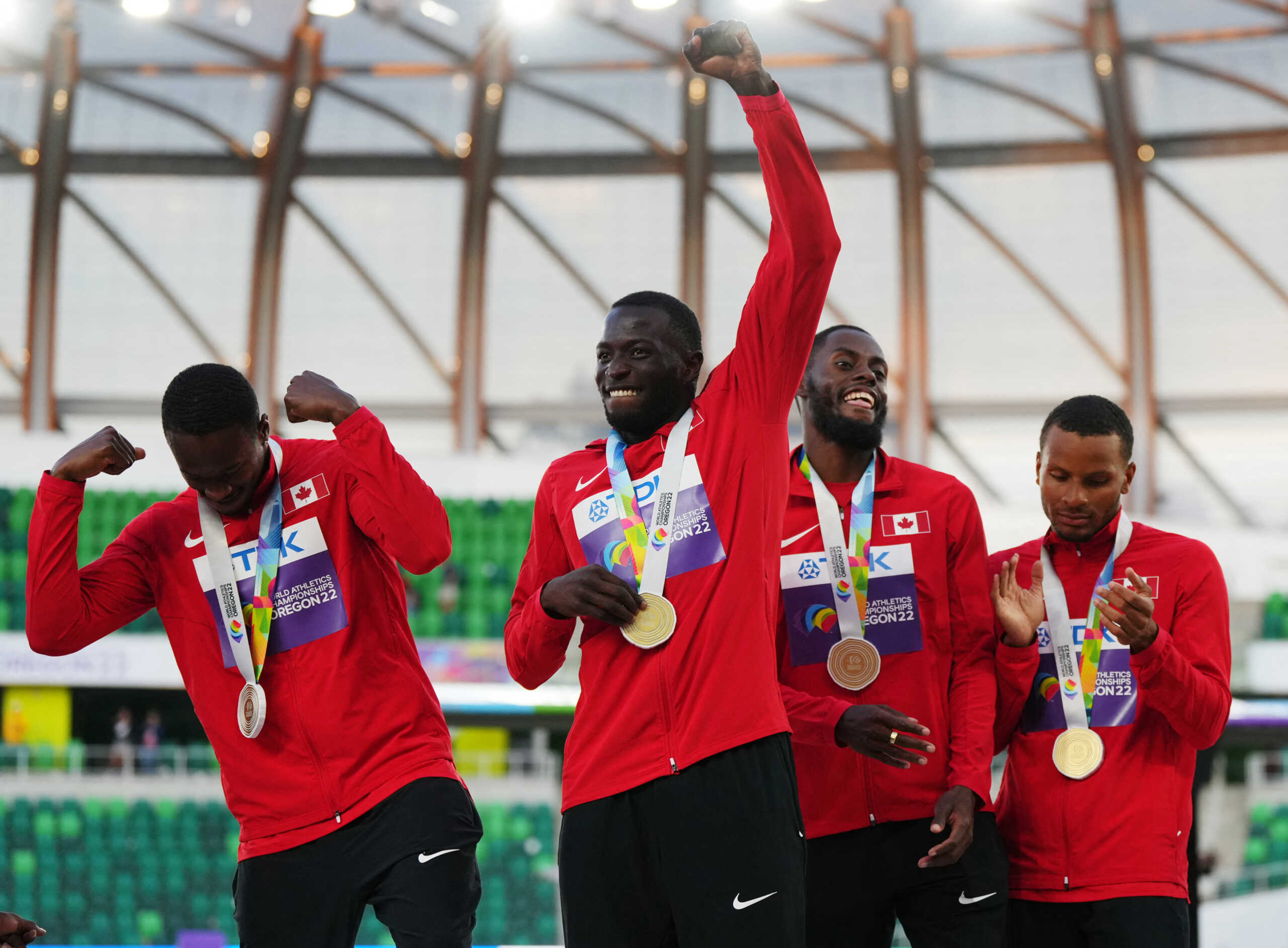 Athletics - World Athletics Championships - Men's 4x100 Metres Relay - Final - Hayward Field, Eugene, Oregon, U.S. - July 23, 2022 Gold medallists Canada's Aaron Brown, Canada's Jerome Blake, Canada's Brendon Rodney and Canada's Andre De Grasse celebrate on the podium during the medal ceremony after winning the men's 4x100 metres relay final REUTERS