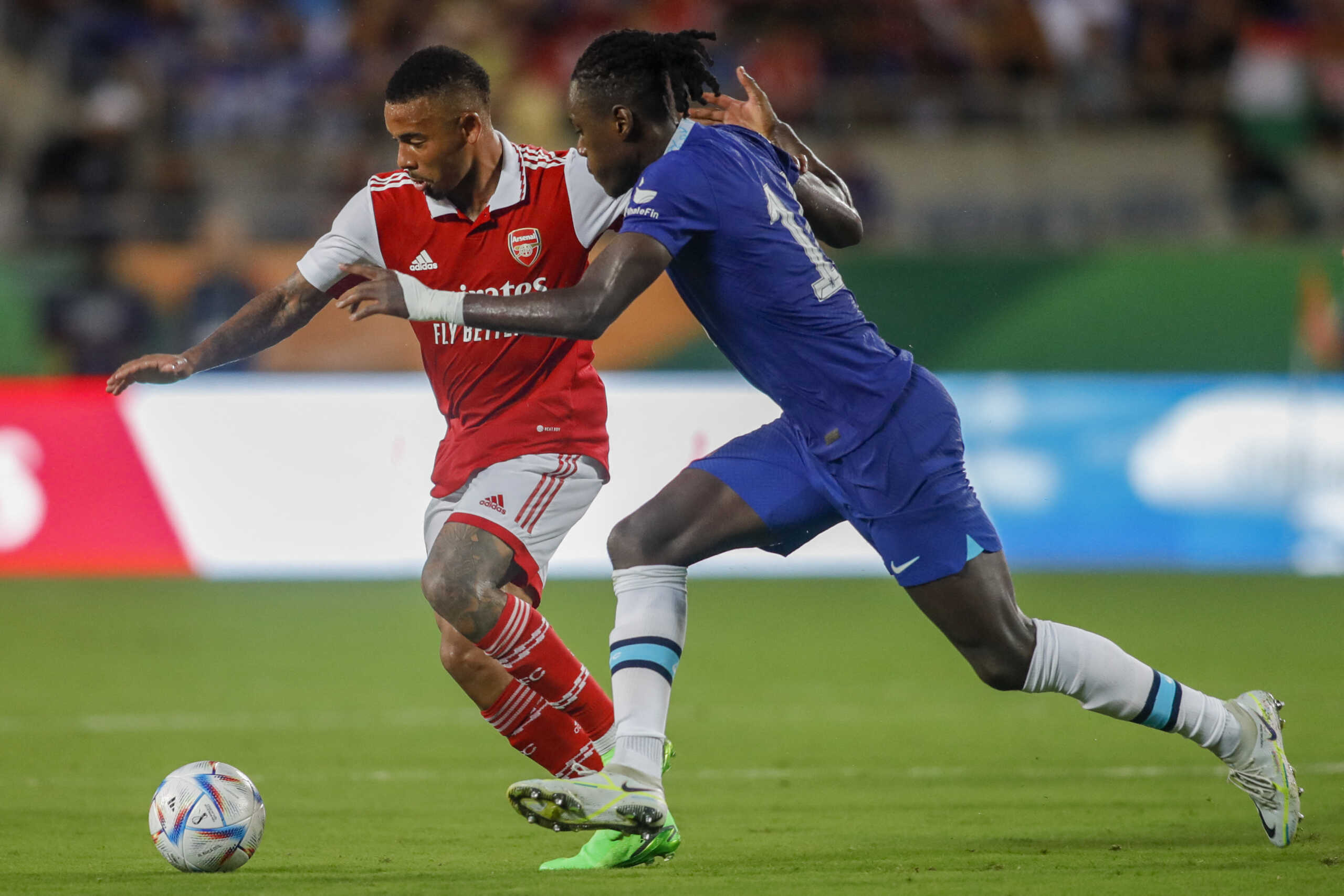 Jul 23, 2022; Orlando, FL, USA; Arsenal forward Gabriel Jesus (9) runs with the ball asChelsea midfielder Trevoh Chalobah (14) defends during the first half at Camping World Stadium. Mandatory Credit: Sam Navarro-USA TODAY Sports