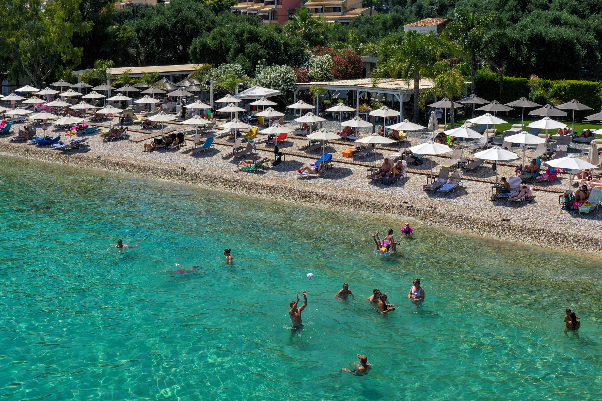People enjoy the sea at Barbati beach on the island of Corfu, Greece, June 30, 2022. REUTERS