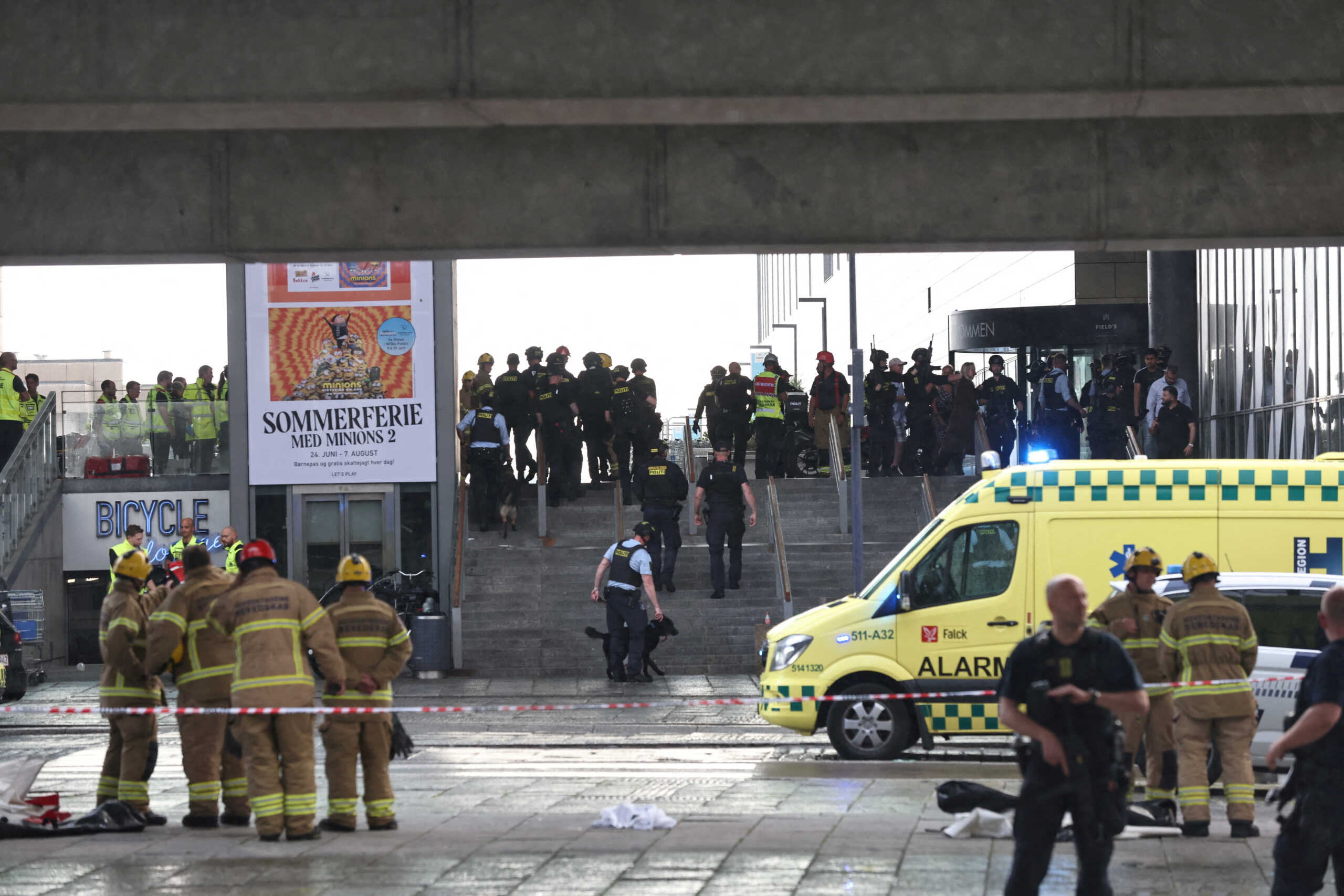 Rescue workers gather outside Field's shopping centre, after Danish police said they received reports of a shooting at the site, in Copenhagen, Denmark, July 3, 2022. Ritzau Scanpix