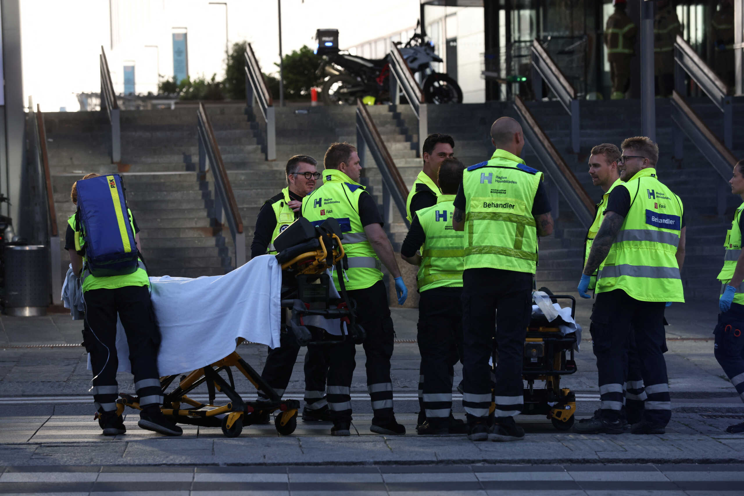 Members of the Danish rescue group Falck arrive at Fields shopping center, after Danish police said they received reports of a shooting at the site, in Copenhagen, Denmark, July 3, 2022. Ritzau Scanpix