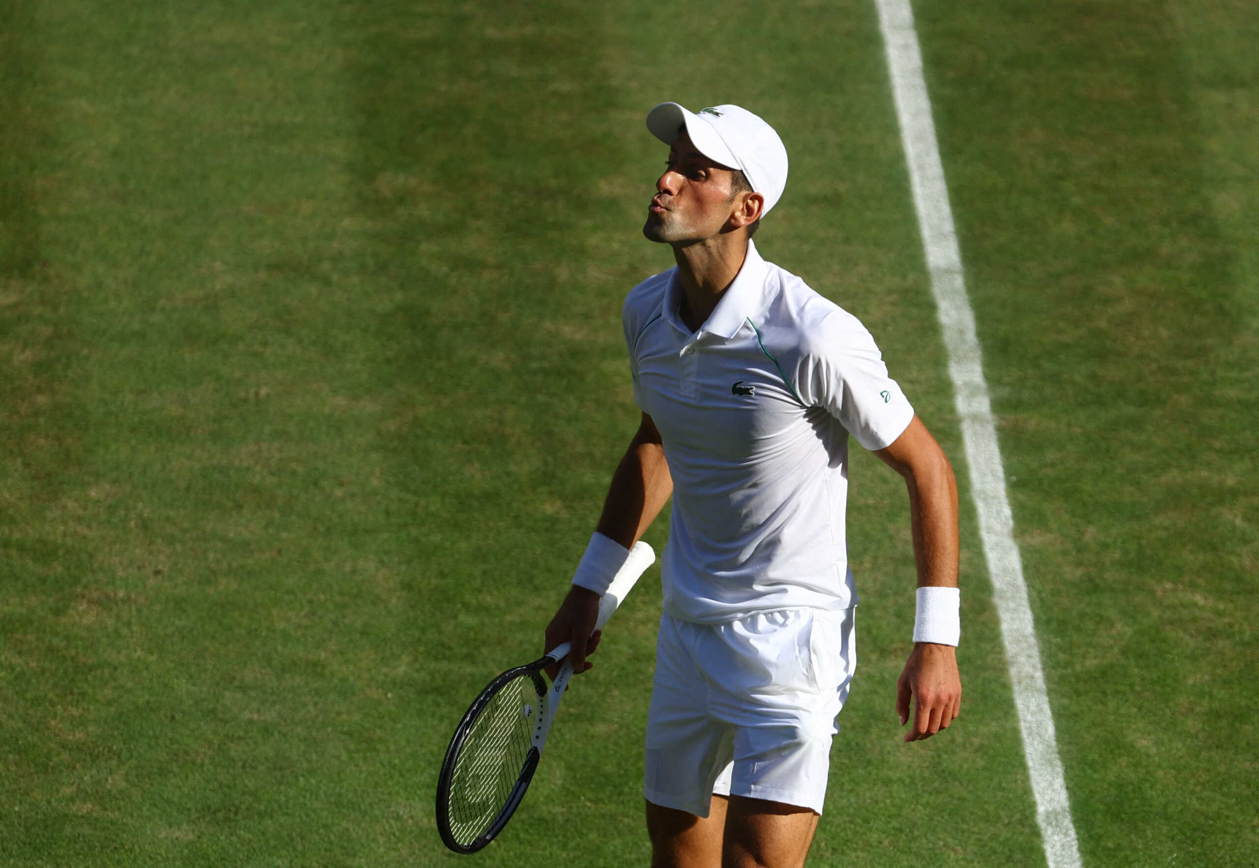 Tennis - Wimbledon - All England Lawn Tennis and Croquet Club, London, Britain - July 8, 2022  Serbia's Novak Djokovic celebrates winning his semi final match against Britain's Cameron Norrie REUTERS