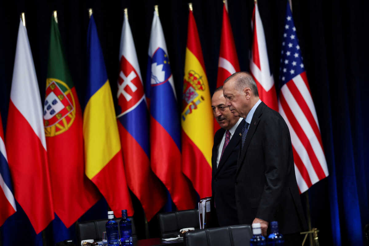 Turkish President Recep Tayyip Erdogan and Turkish Foreign Minister Mevlut Cavusoglu attend a NATO summit in Madrid, Spain June 30, 2022. REUTERS