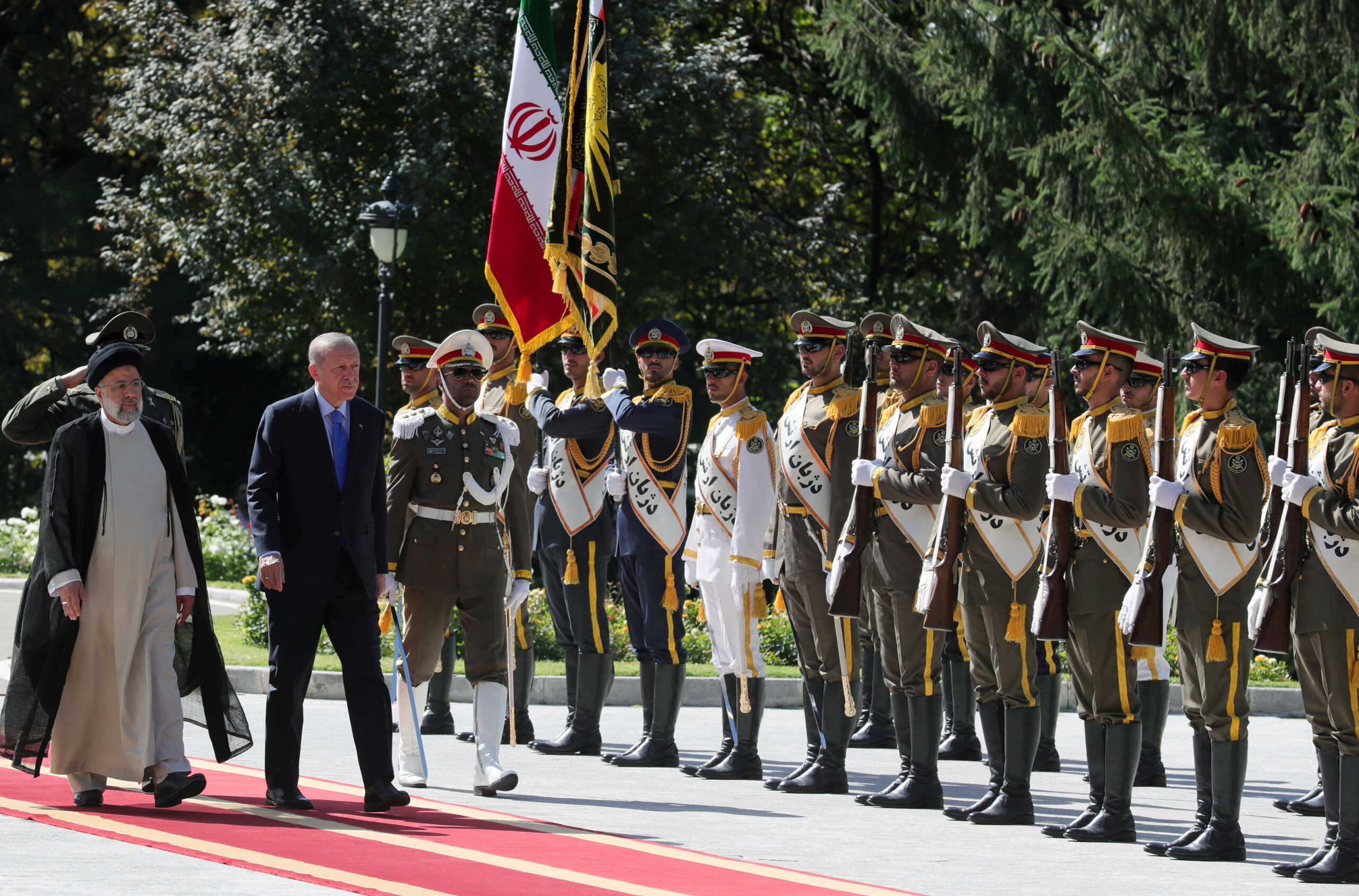 Turkish President Tayyip Erdogan and his Iranian counterpart Ebrahim Raisi attend a welcoming ceremony in Tehran, Iran July 19, 2022. Presidential Press Office