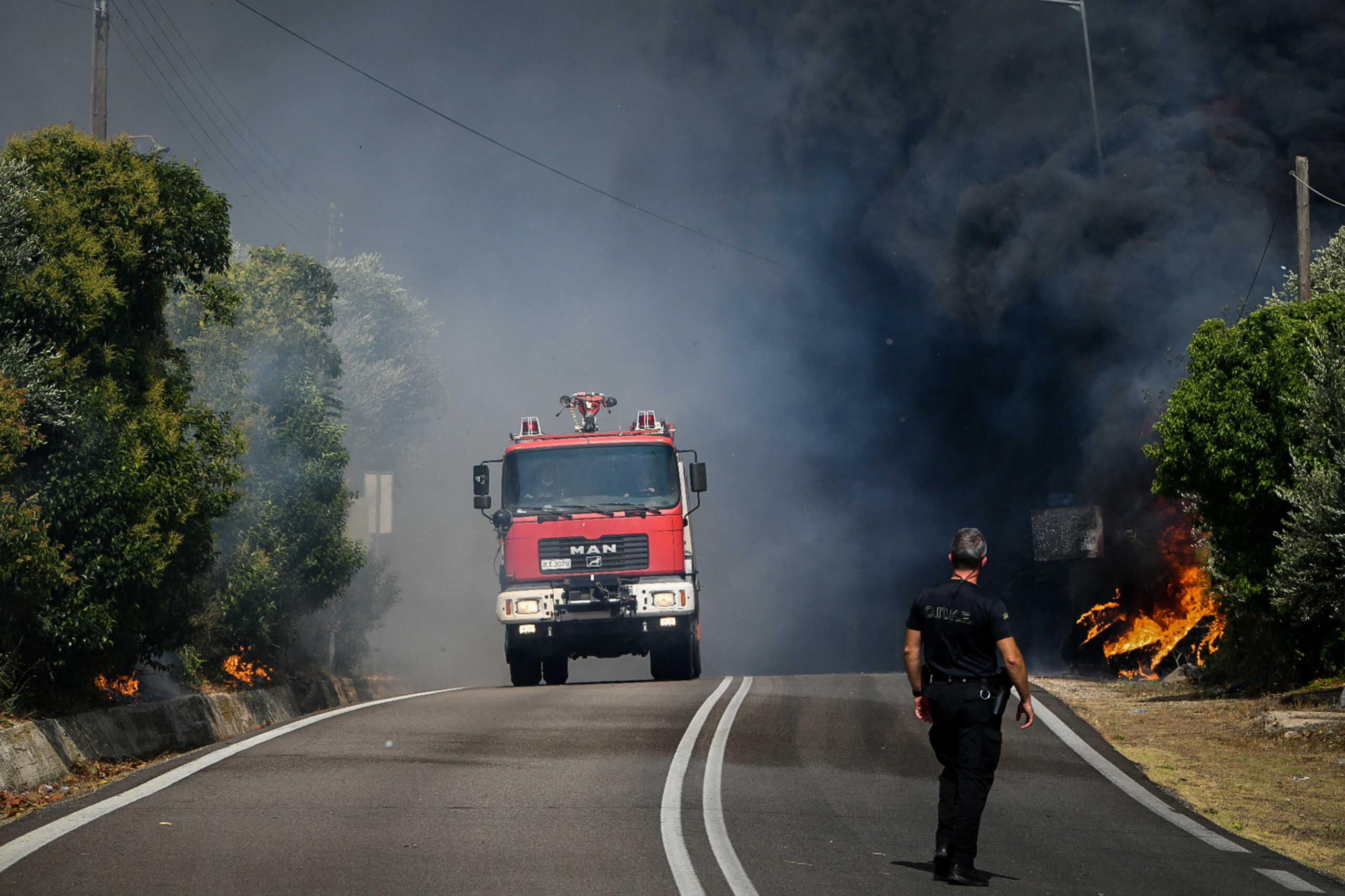 A firefighting vehicle is seen, as a wildfire burns at the village of Krestena, in the western Peloponnese, Greece July 24, 2022. Giannis Spirounis