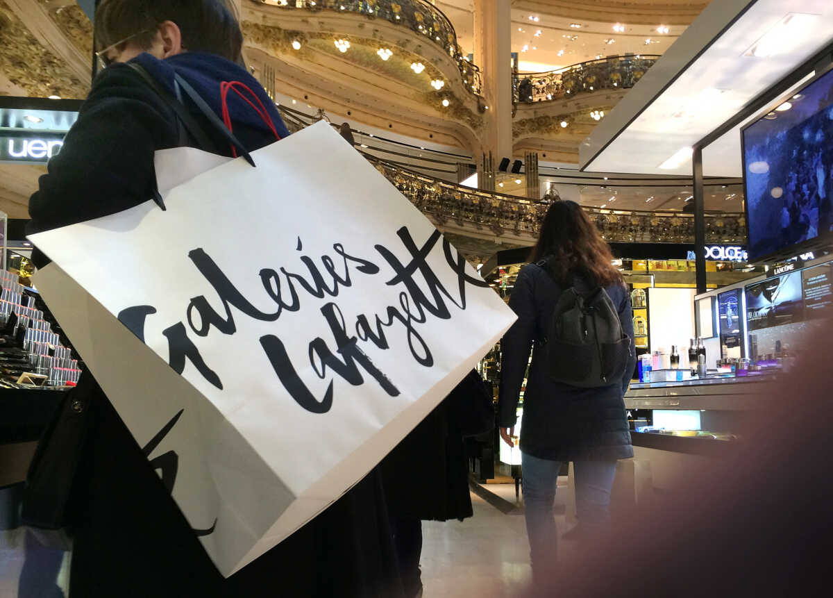 FILE PHOTO: A shopper in the Galeries Lafayette department store in Paris, France, February 26, 2016. REUTERS