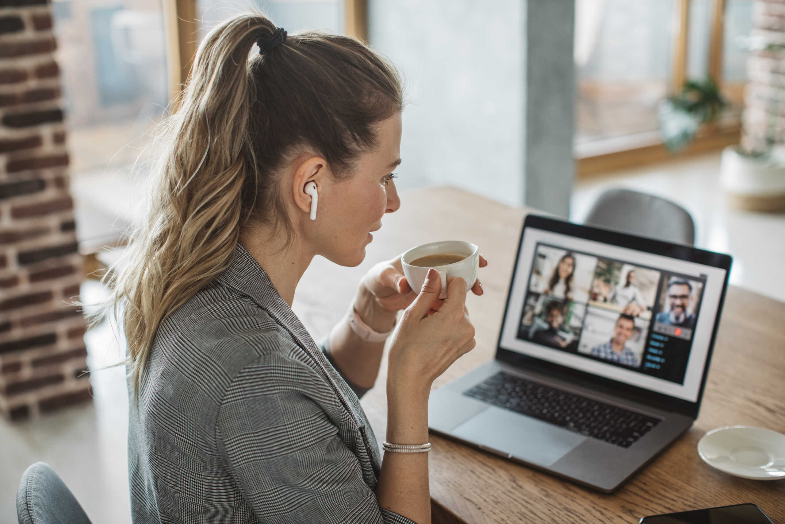 Women at home during pandemic isolation have conference  call