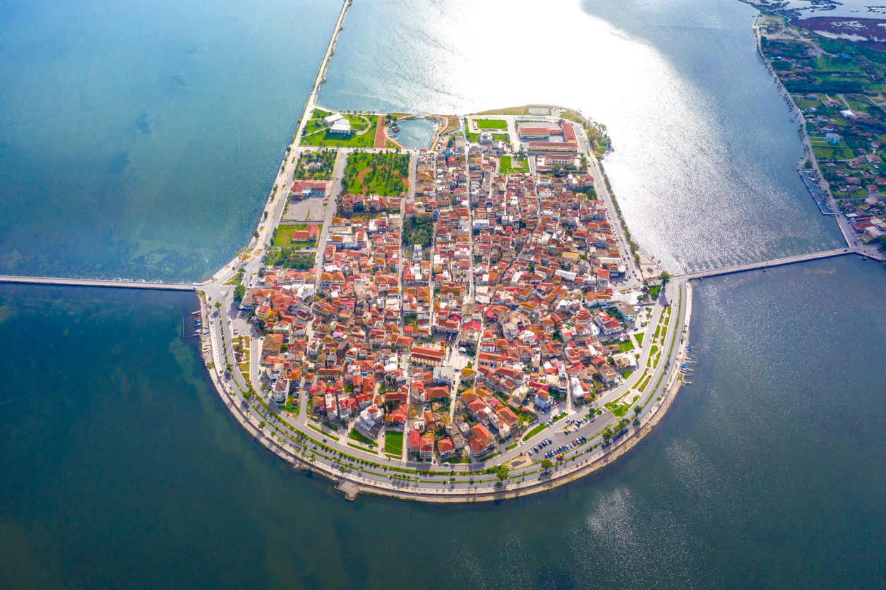 Aerial drone view of the famous island - fishing village of Aitoliko in Aetolia - Akarnania, Greece situated in the middle of Messolongi archipelago known as the Little Venice of Greece