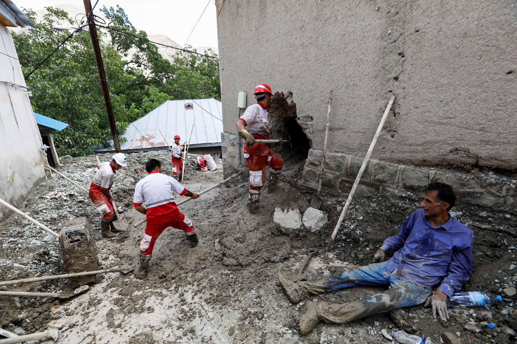 Rescuers work following the flood in Firuzkuh, east of Tehran, Iran July 30, 2022. Iranian Red Crescent Society