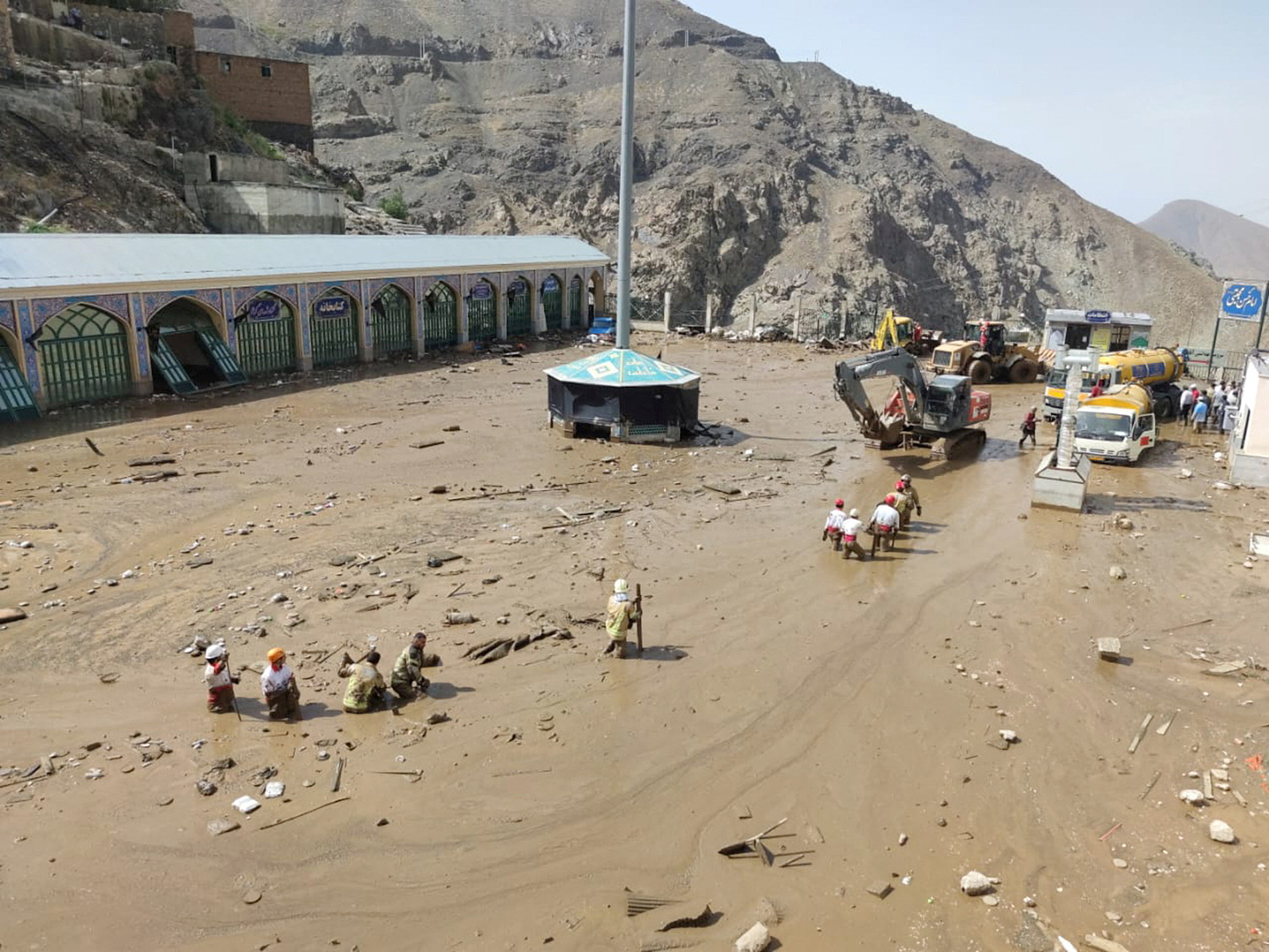 Rescuers work following the flood in Imamzadeh Davoud village in the north of Tehran, Iran July 28, 2022. Iranian Red Crescent Society