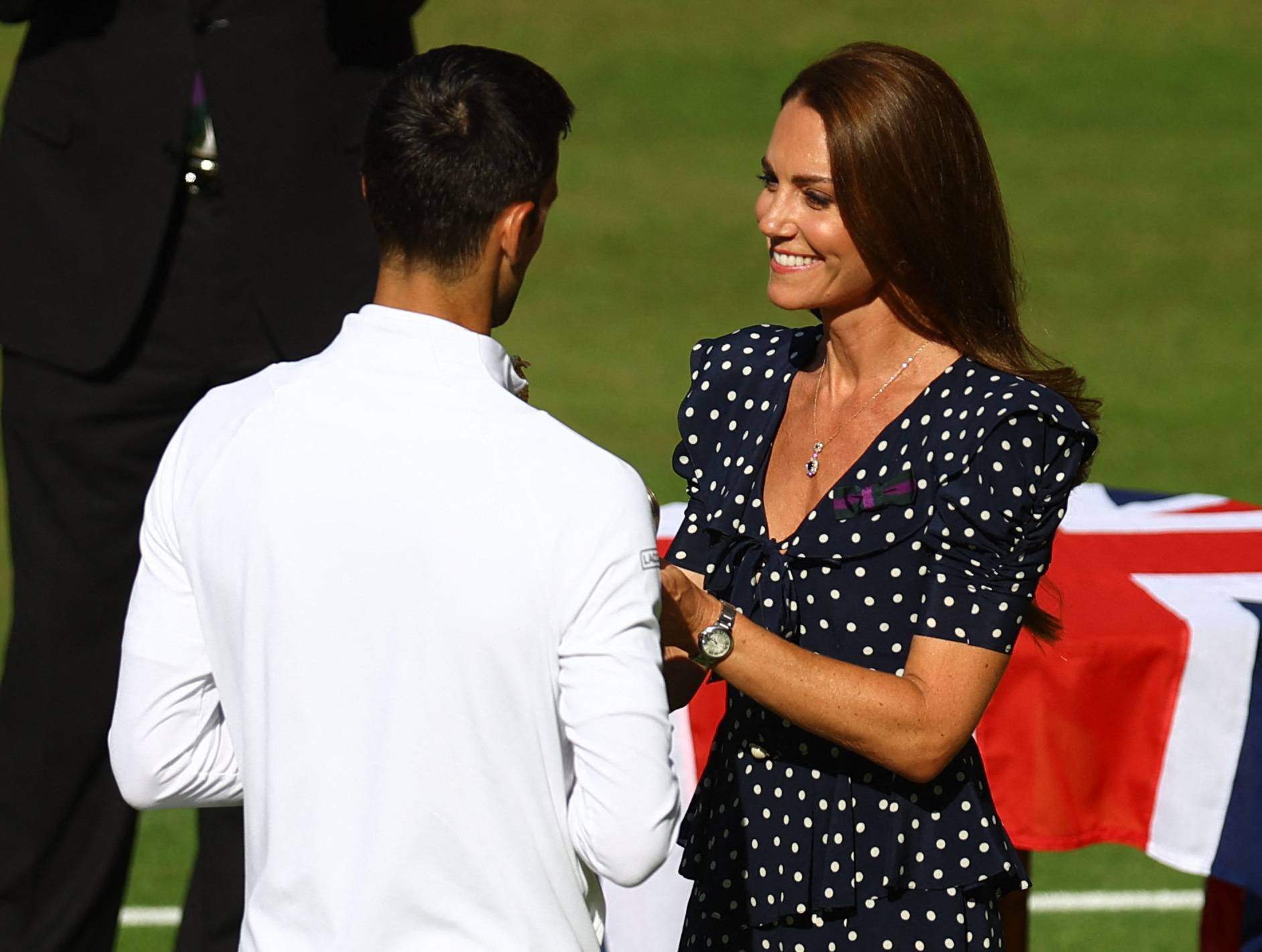 Tennis - Wimbledon - All England Lawn Tennis and Croquet Club, London, Britain - July 10, 2022 Britain's Catherine, the Duchess of Cambridge presents the trophy to Serbia's Novak Djokovic after he won the men's singles final against Australia's Nick Kyrgios REUTERS