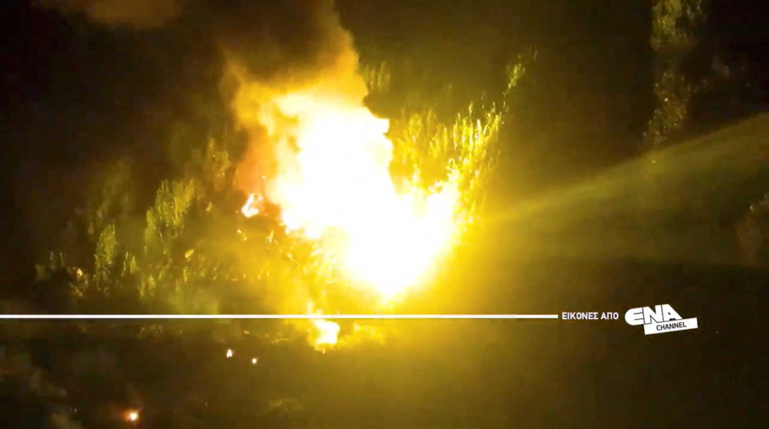 A drone view shows the burning debris at the crash site of an Antonov An-12 cargo plane owned by a Ukrainian company, near Kavala, Greece, July 16, 2022. ENA Channel