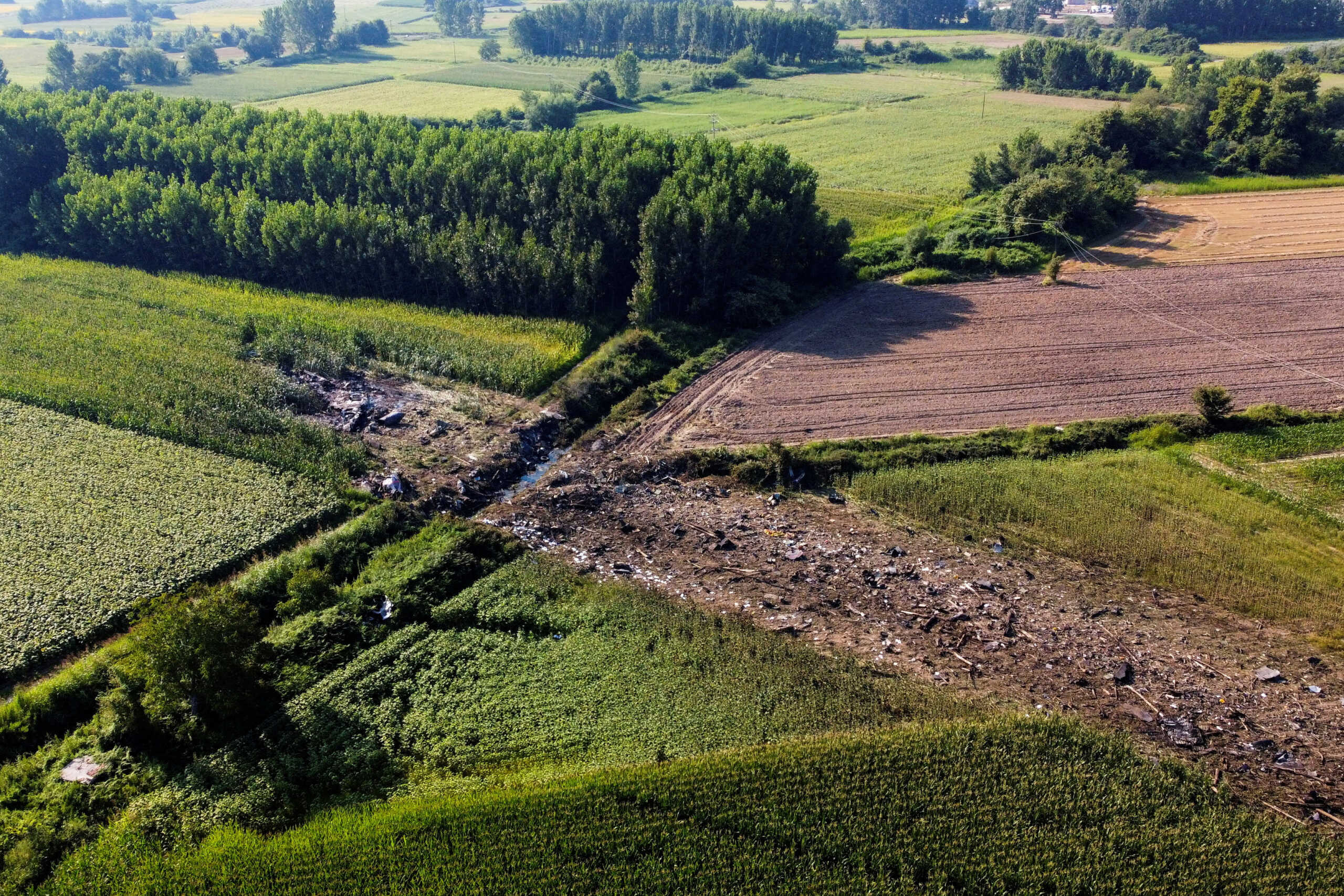 A view of the crash site of an Antonov An-12 cargo plane owned by a Ukrainian company, near Kavala, Greece, July 17, 2022. REUTERS