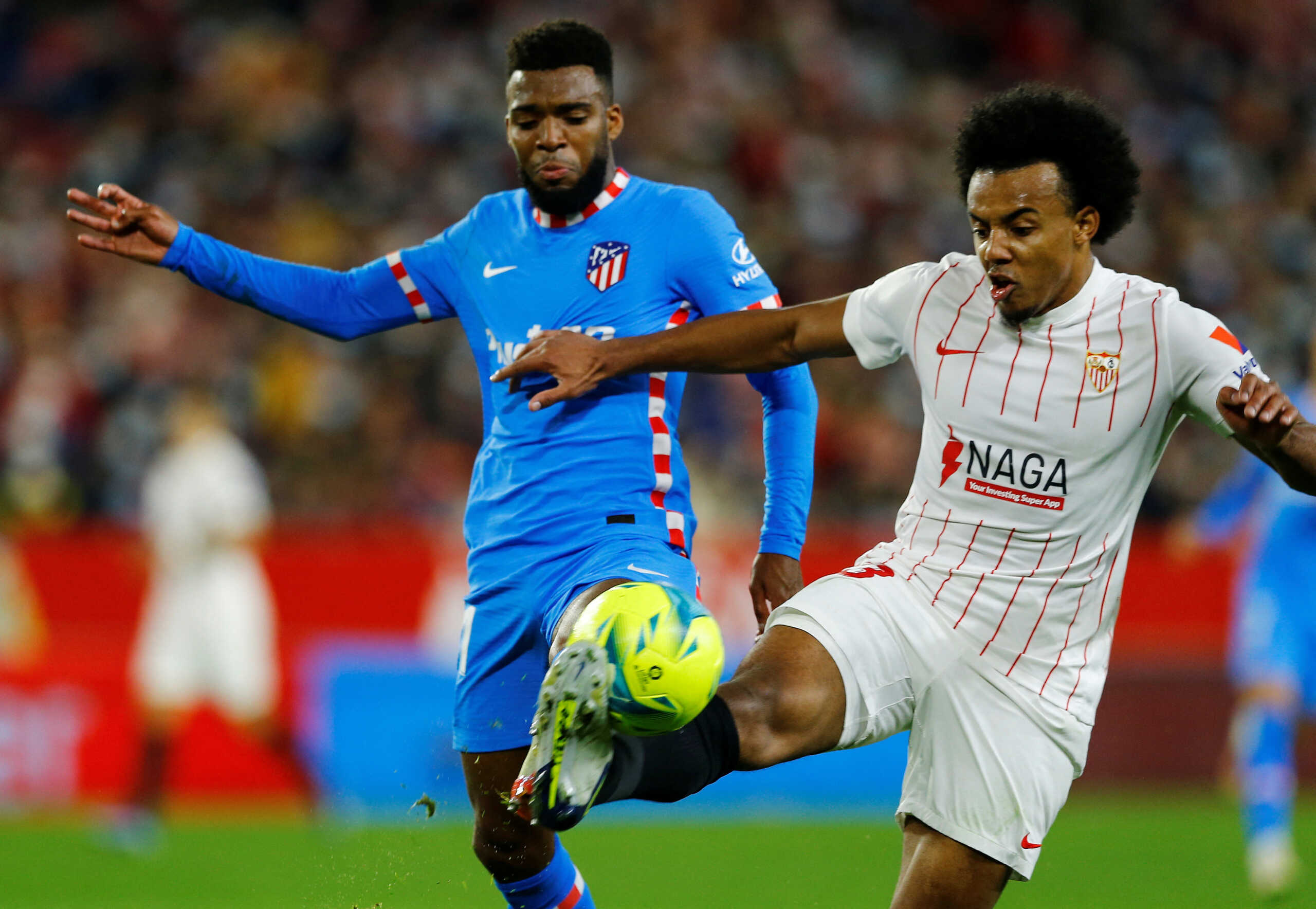 FILE PHOTO: Soccer Football - LaLiga - Sevilla v Atletico Madrid - Ramon Sanchez Pizjuan, Seville, Spain - December 18, 2021 Atletico Madrid's Thomas Lemar in action with Sevilla's Jules Kounde REUTERS