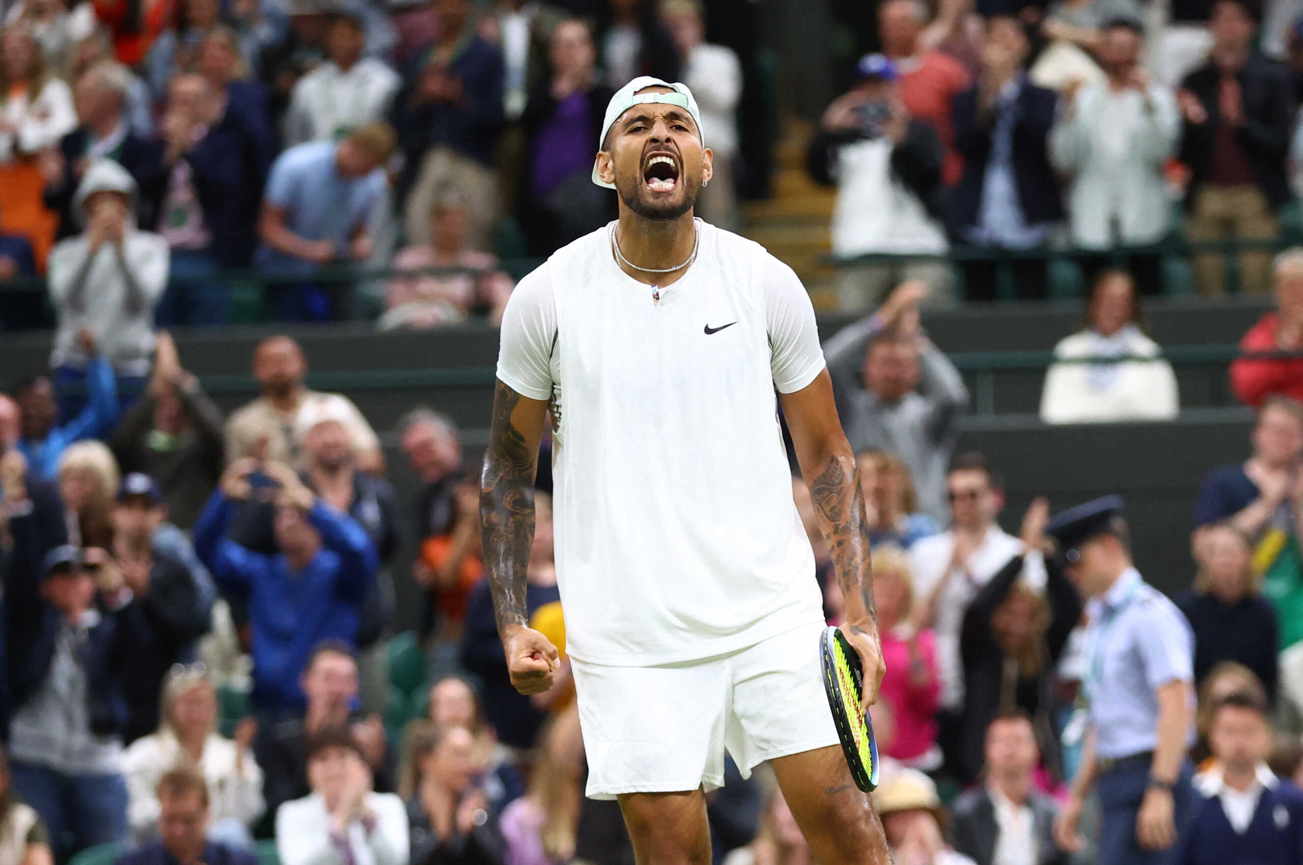 Tennis - Wimbledon - All England Lawn Tennis and Croquet Club, London, Britain - July 2, 2022 Australia's Nick Kyrgios celebrates winning his third round match against Greece's Stefanos Tsitsipas REUTERS