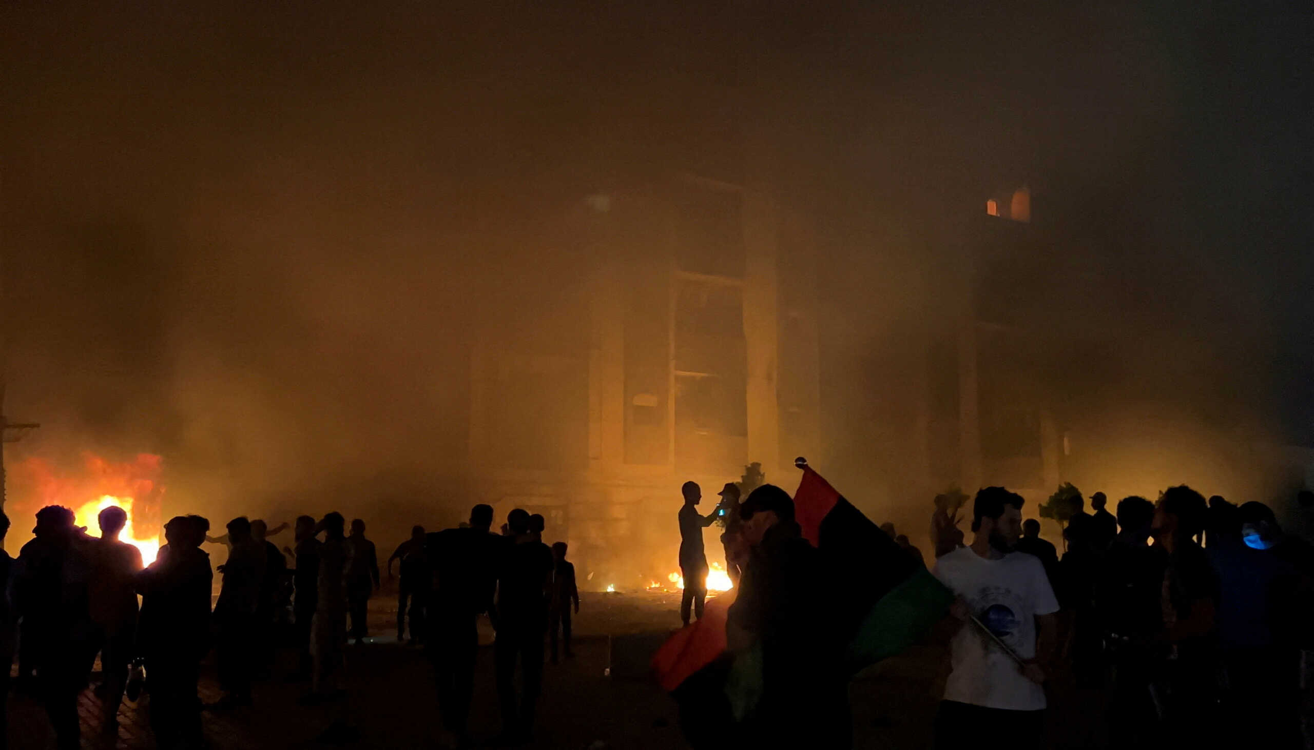 Protesters set fire to the Libyan parliament building after protests against the failure of the government in Tobruk, Libya July 1, 2022. REUTERS