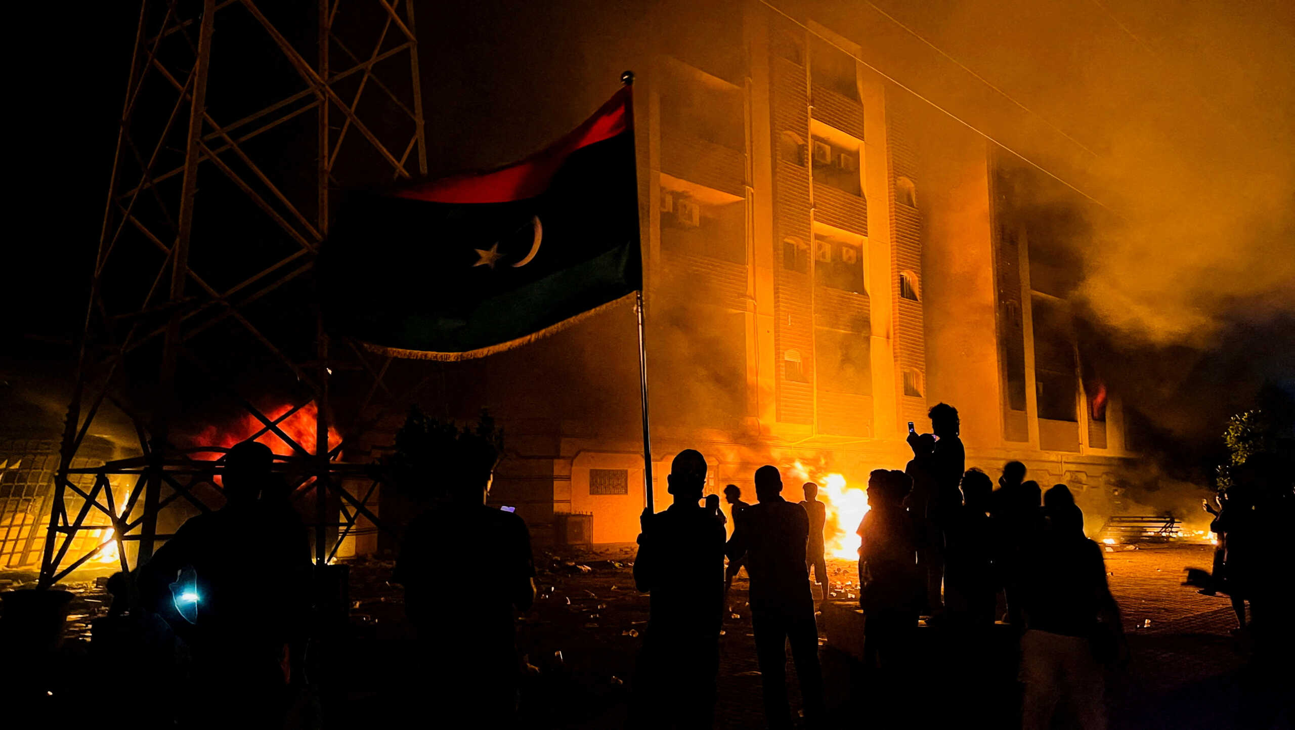 Protesters set fire to the Libyan parliament building after protests against the failure of the government in Tobruk, Libya July 1, 2022. REUTERS