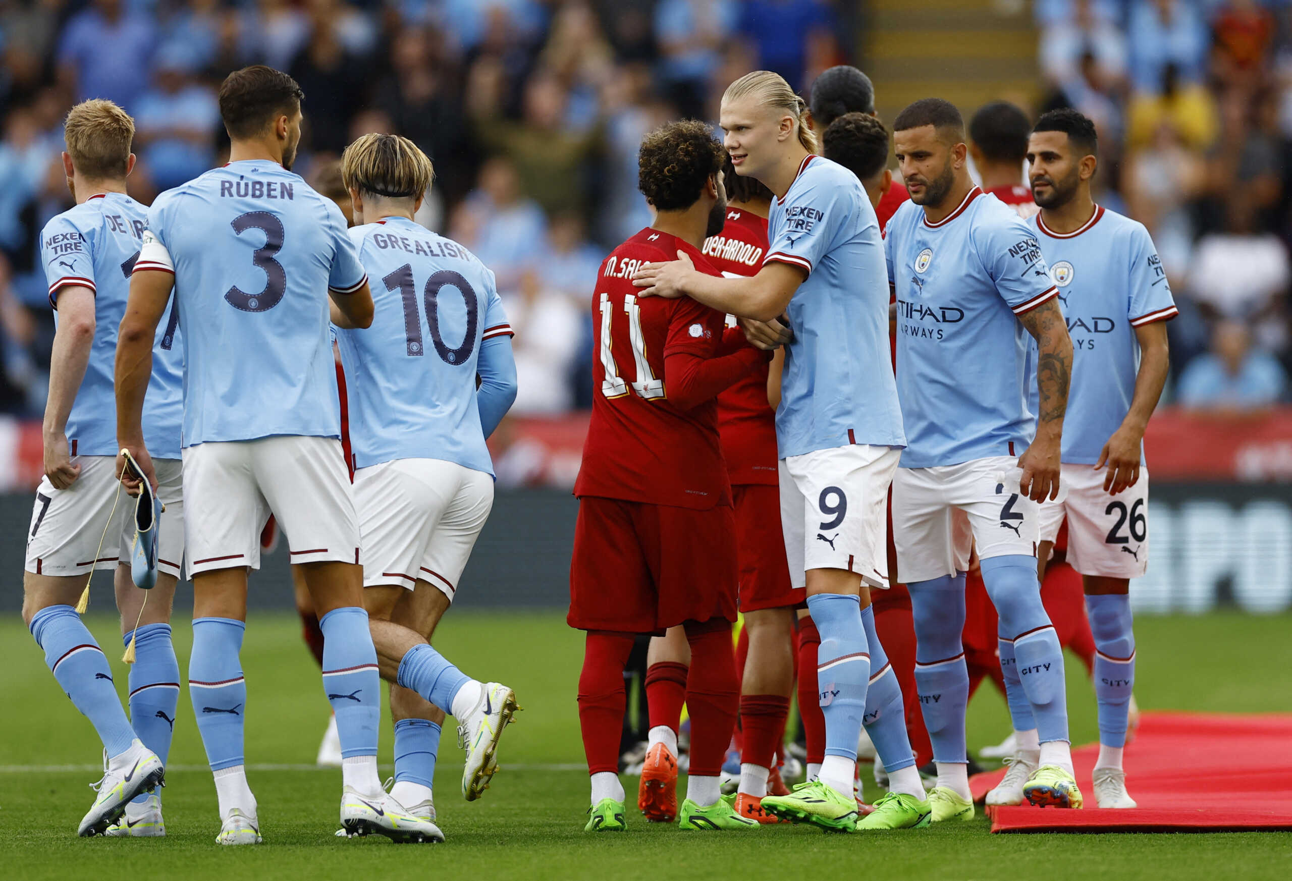 Soccer Football - Community Shield - Liverpool v Manchester City - King Power Stadium, Leicester, Britain - July 30, 2022 Liverpool's Mohamed Salah shakes hands with Manchester City's Erling Braut Haaland before the match Action Images via Reuters
