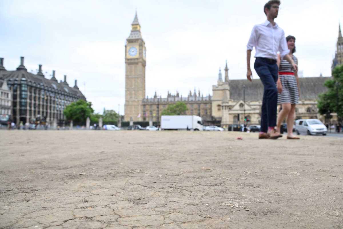 A general view of cracked earth with the houses of Parliament and the Elizabeth Tower, more commonly known as Big Ben, seen behind as hot weather continues, in Parliament Square, London, Britain, July 12, 2022. REUTERS