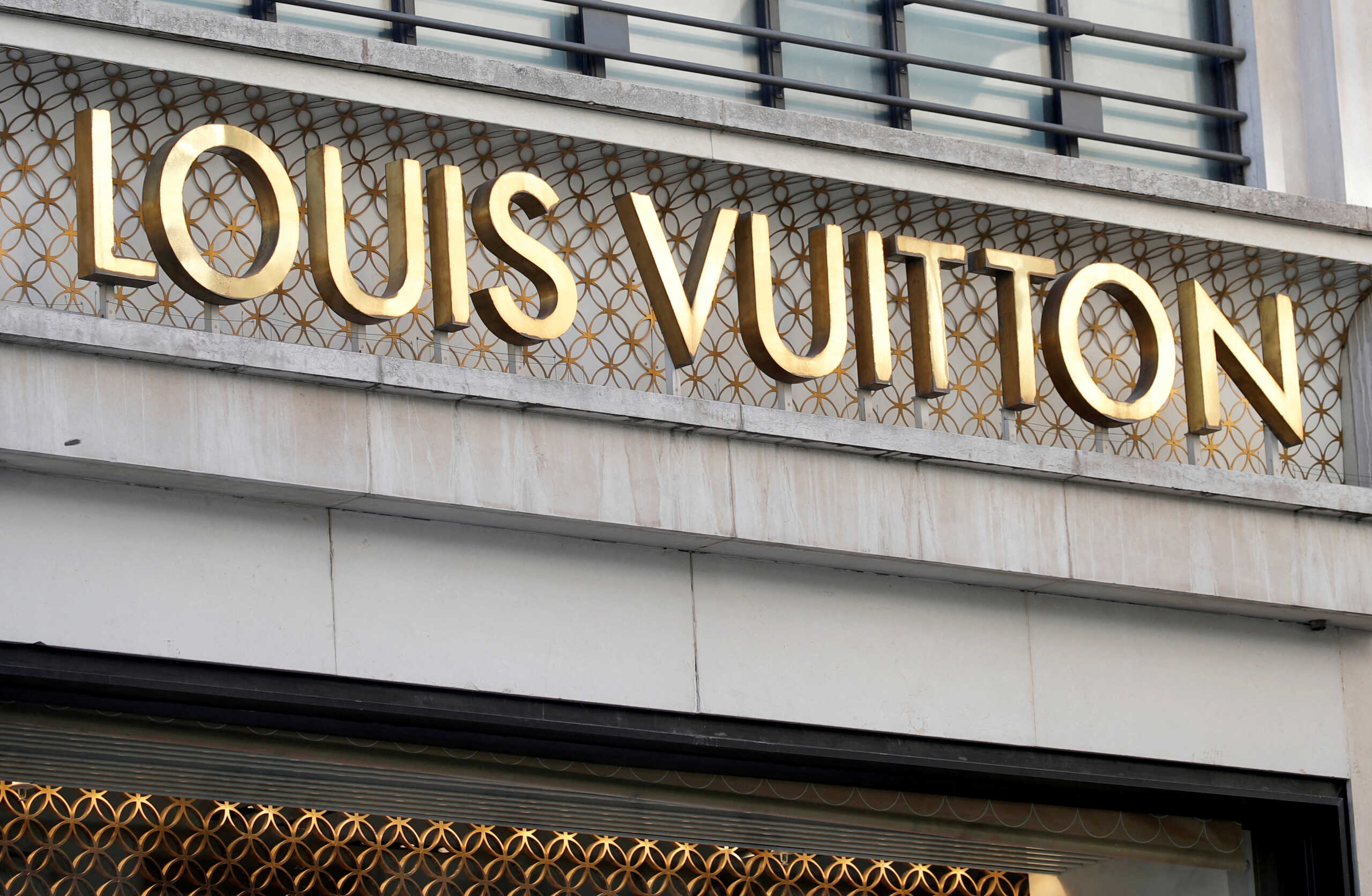FILE PHOTO: A Louis Vuitton logo is seen outside a store on the Champs-Elysees [n Paris, France, September 18, 2020.   REUTERS