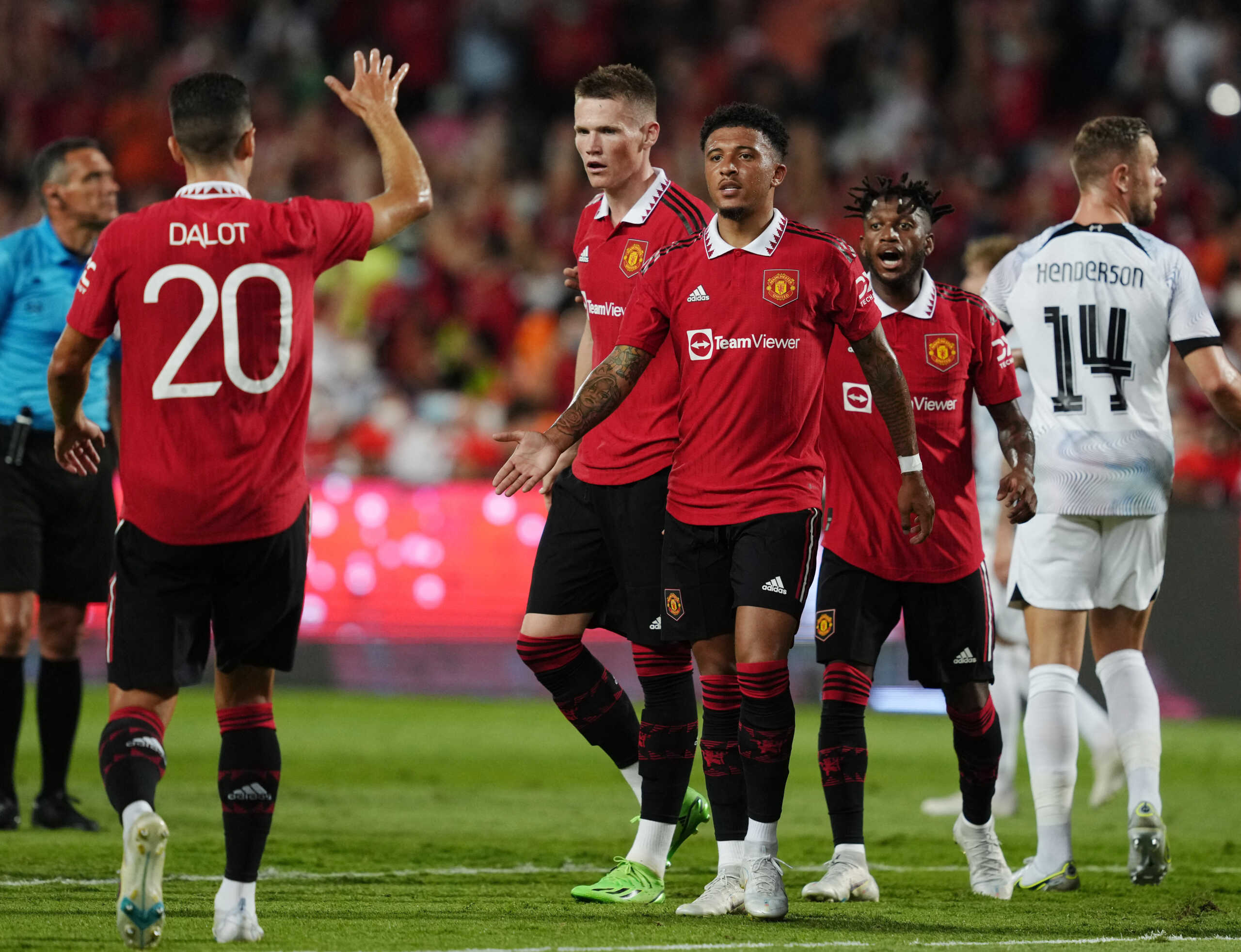Soccer Football - Pre Season Friendly - Manchester United v Liverpool - Rajamangala National Stadium, Bangkok, Thailand - July 12, 2022 Manchester Unite's Jadon Sancho celebrates scoring their first goal with Diogo Dalot REUTERS