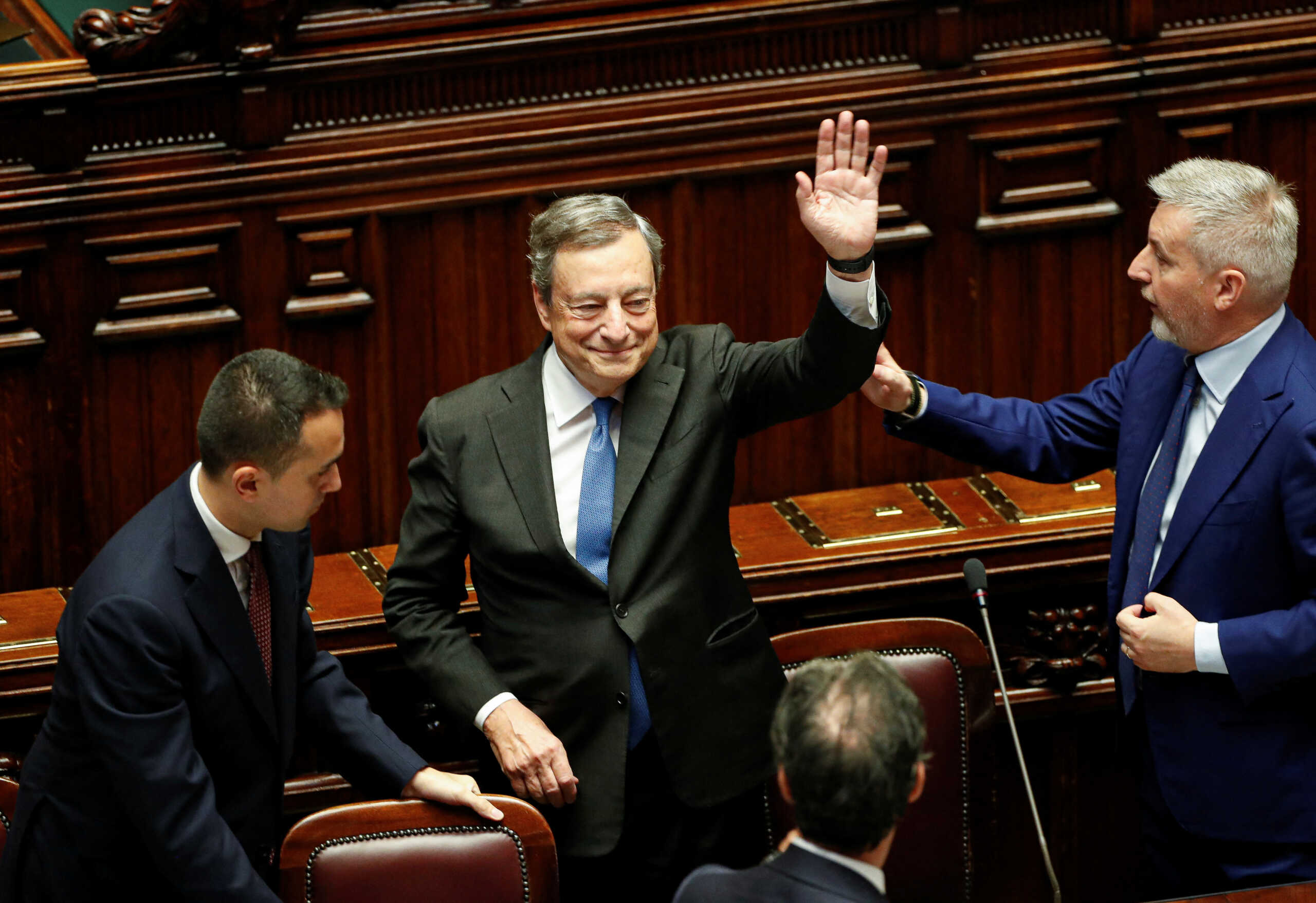 Italy's Prime Minister Mario Draghi waves as he leaves after addressing the lower house of parliament ahead of a vote of confidence for the government after he tendered his resignation last week in the wake of a mutiny by a coalition partner, in Rome, Italy July 21, 2022. REUTERS