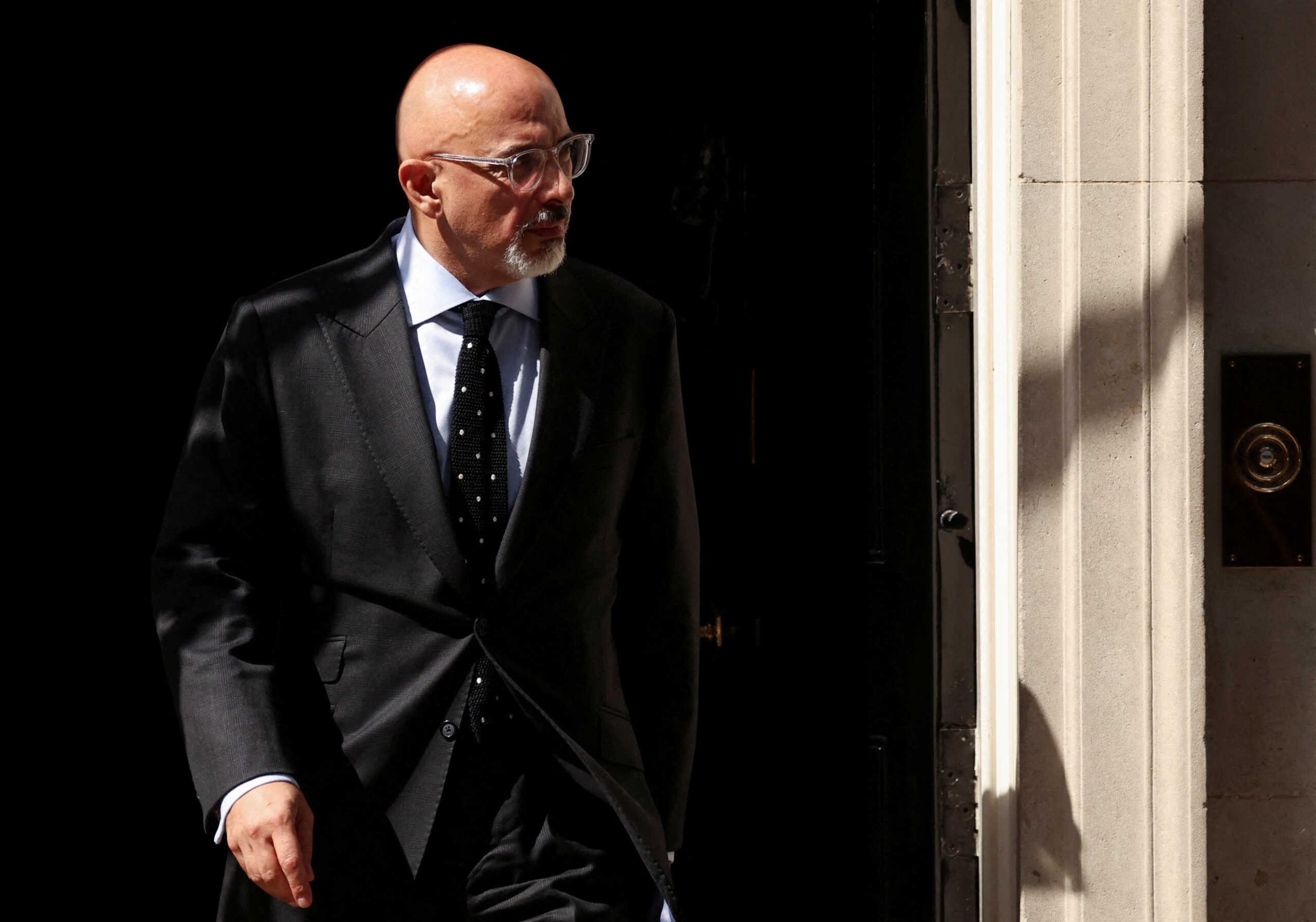 FILE PHOTO: British new Chancellor of the Exchequer Nadhim Zahawi walks outside at Downing Street in London, Britain, July 7, 2022. REUTERS