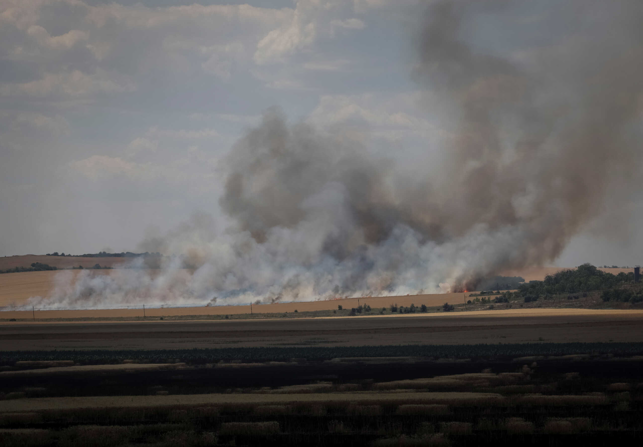 A wheat field burns after shelling, amid Russia's attack, in Donetsk region, Ukraine July 8, 2022. REUTERS
