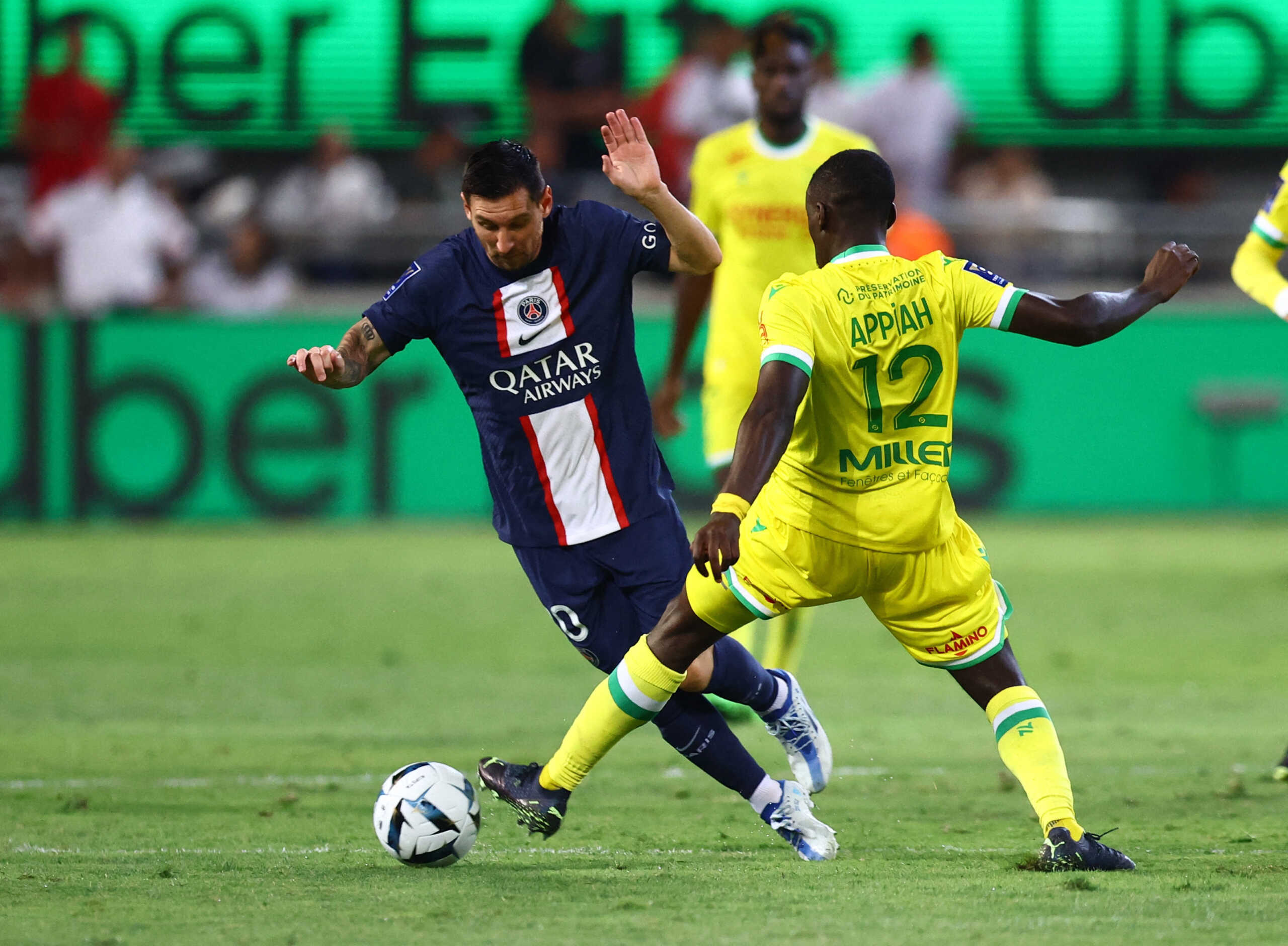 Soccer Football - Trophee des Champions - Paris St Germain v Nantes - Bloomfield Stadium, Tel Aviv, Israel - July 31, 2022 Paris St Germain's Lionel Messi in action with Nantes' Dennis Appiah REUTERS